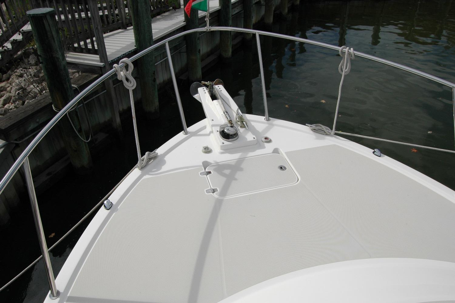 Bow of 2014 Back Cove 34 boat with railing and anchor system.