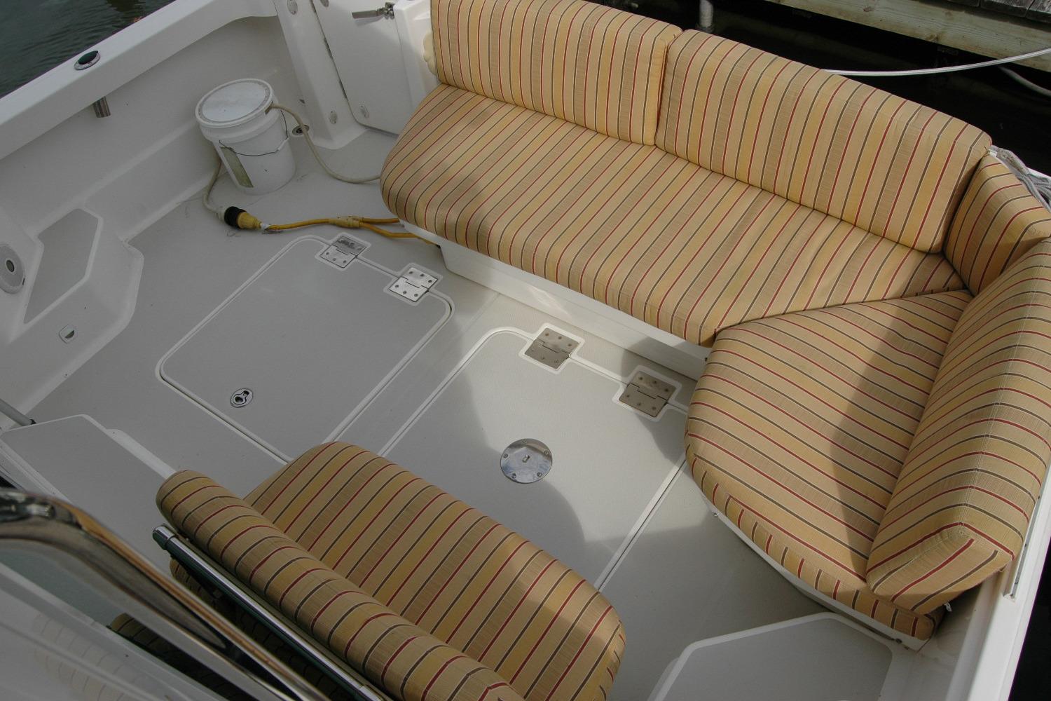 2014 Back Cove 34 boat interior with striped seating and clean deck layout.