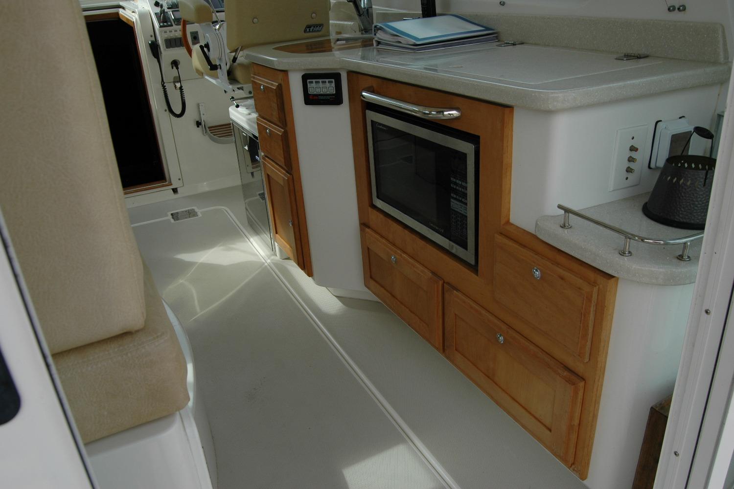 Interior of 2014 Back Cove 34 yacht with kitchen area and microwave.