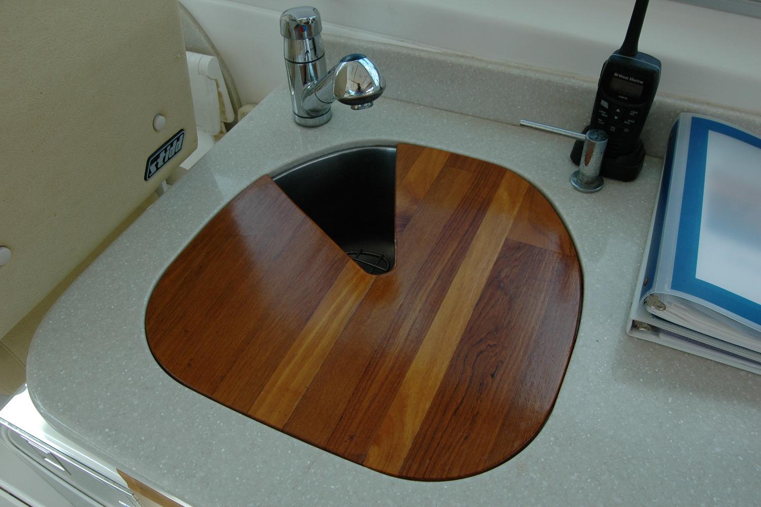 2014 Back Cove 34 yacht sink with wooden cover and faucet.