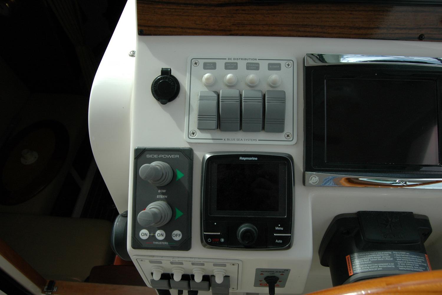 Control panel of a 2014 Back Cove 34 boat with navigation and power switches.