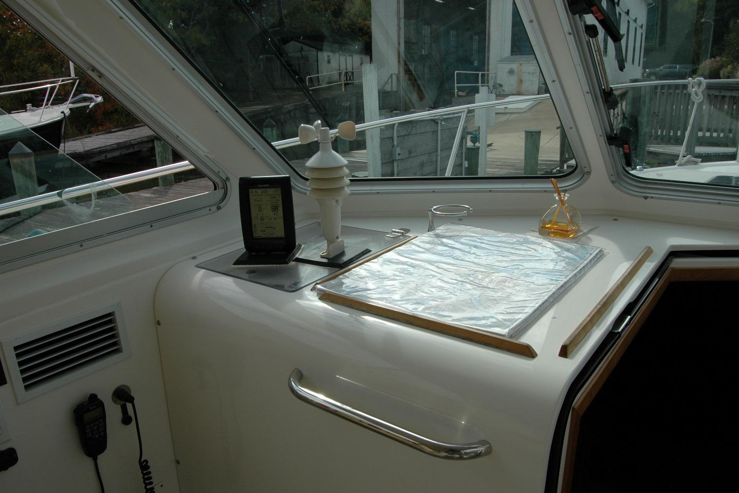 Interior of a 2014 Back Cove 34 boat with navigation equipment and chart.