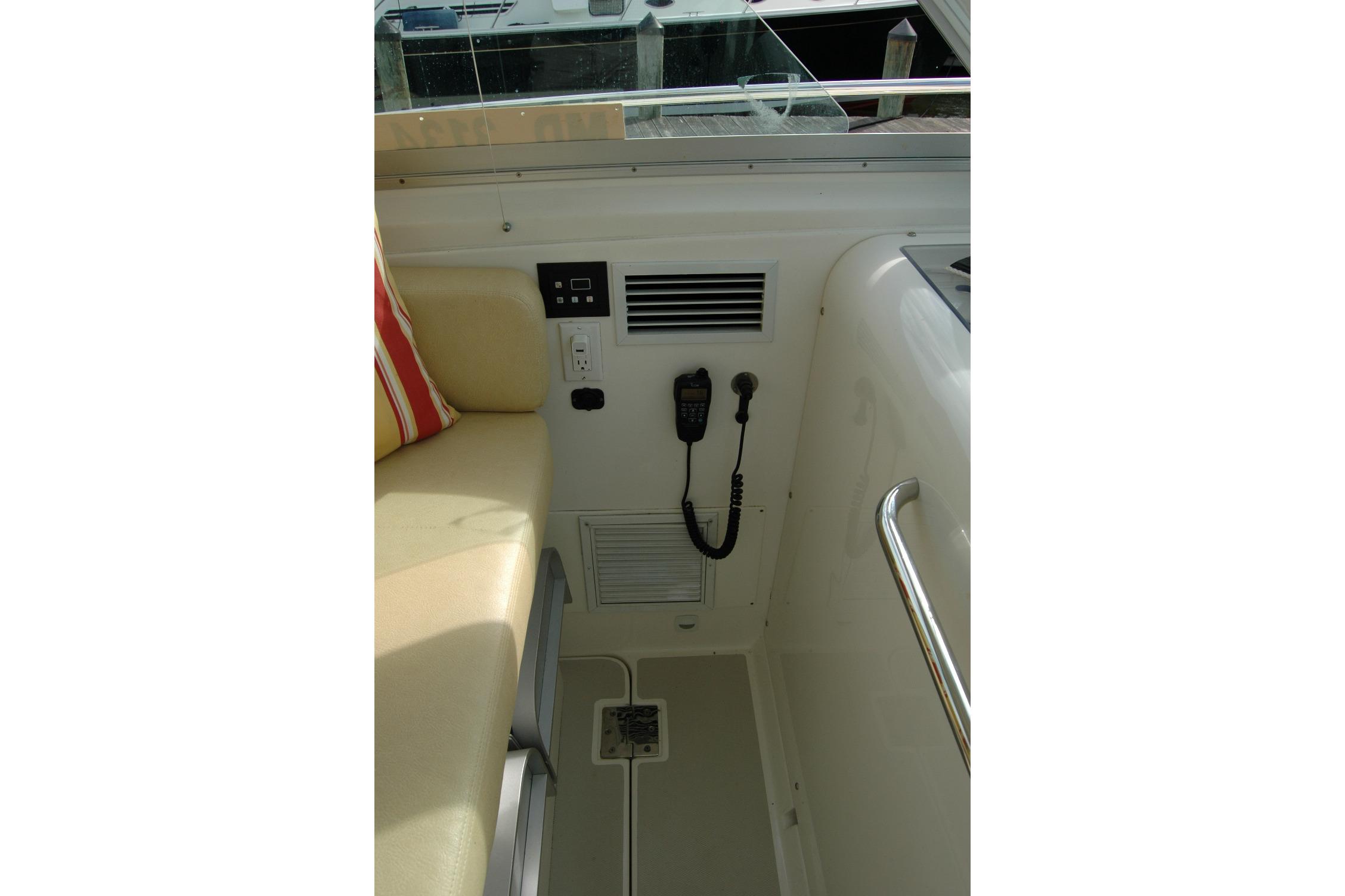 Interior of 2014 Back Cove 34 boat showing seating and control panel.