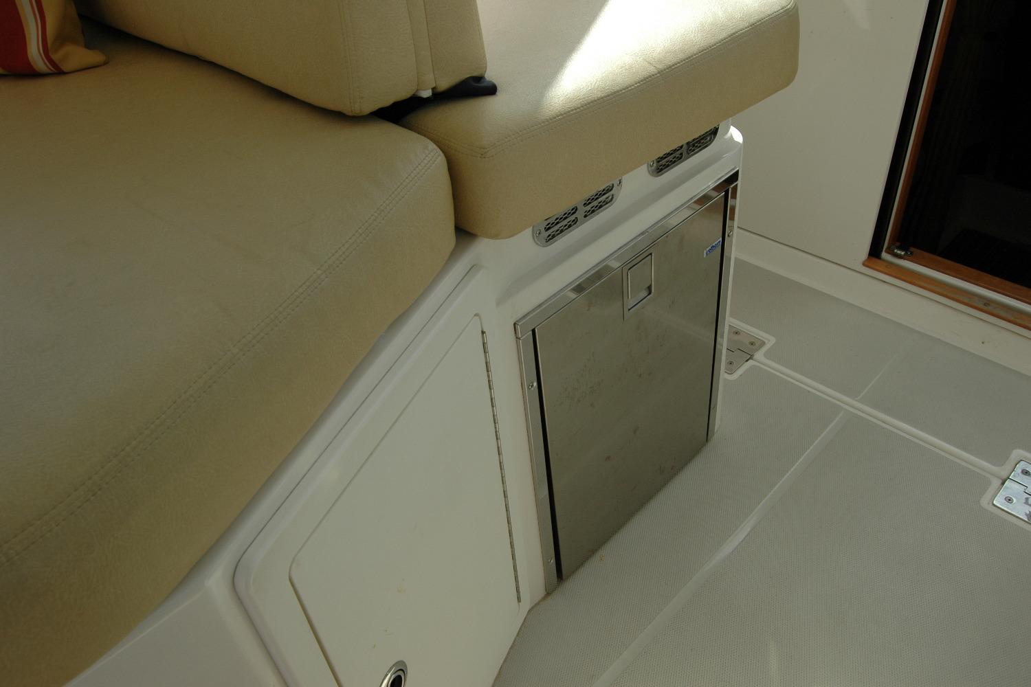 Interior seating and storage area on a 2014 Back Cove 34 boat.