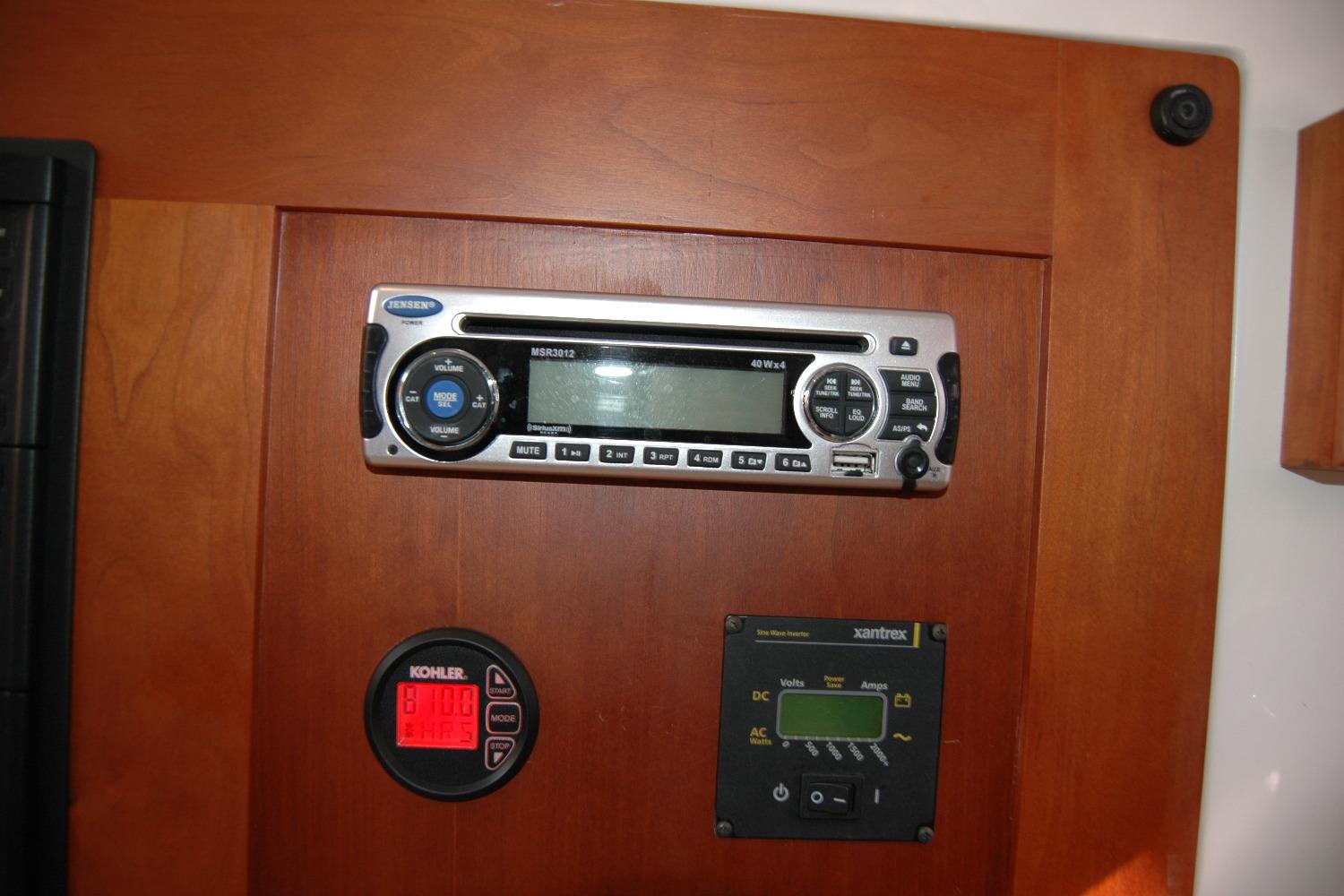 2014 Back Cove 34 interior control panel with Jensen stereo and Xantrex display.