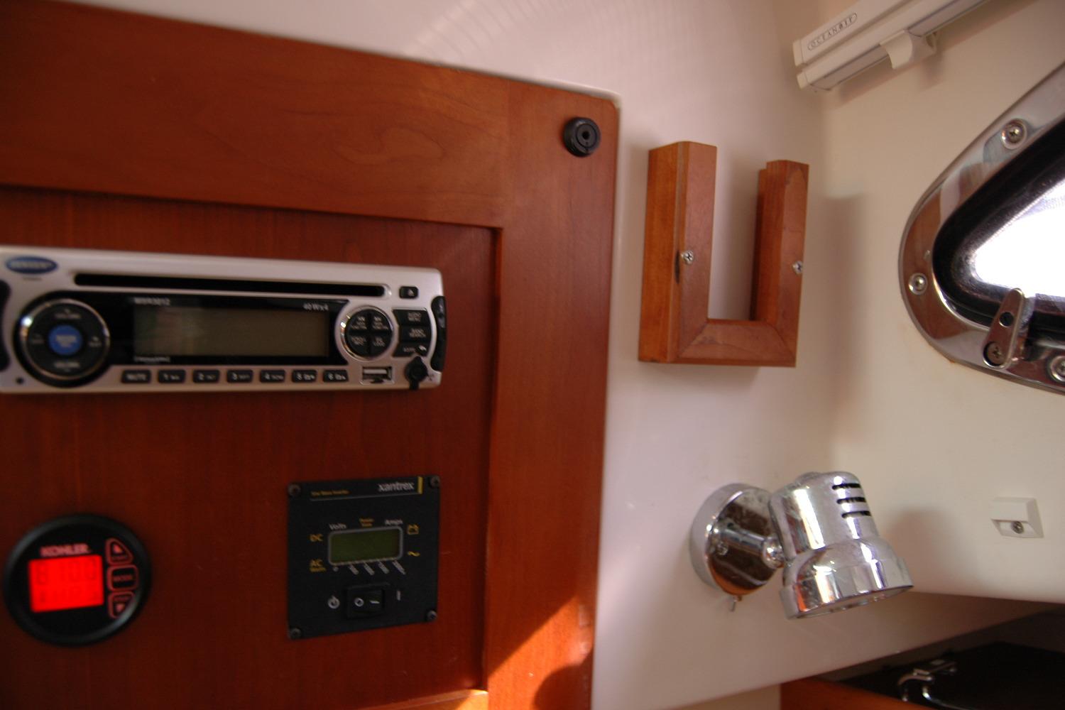 2014 Back Cove 34 interior with stereo, control panel, and reading light.