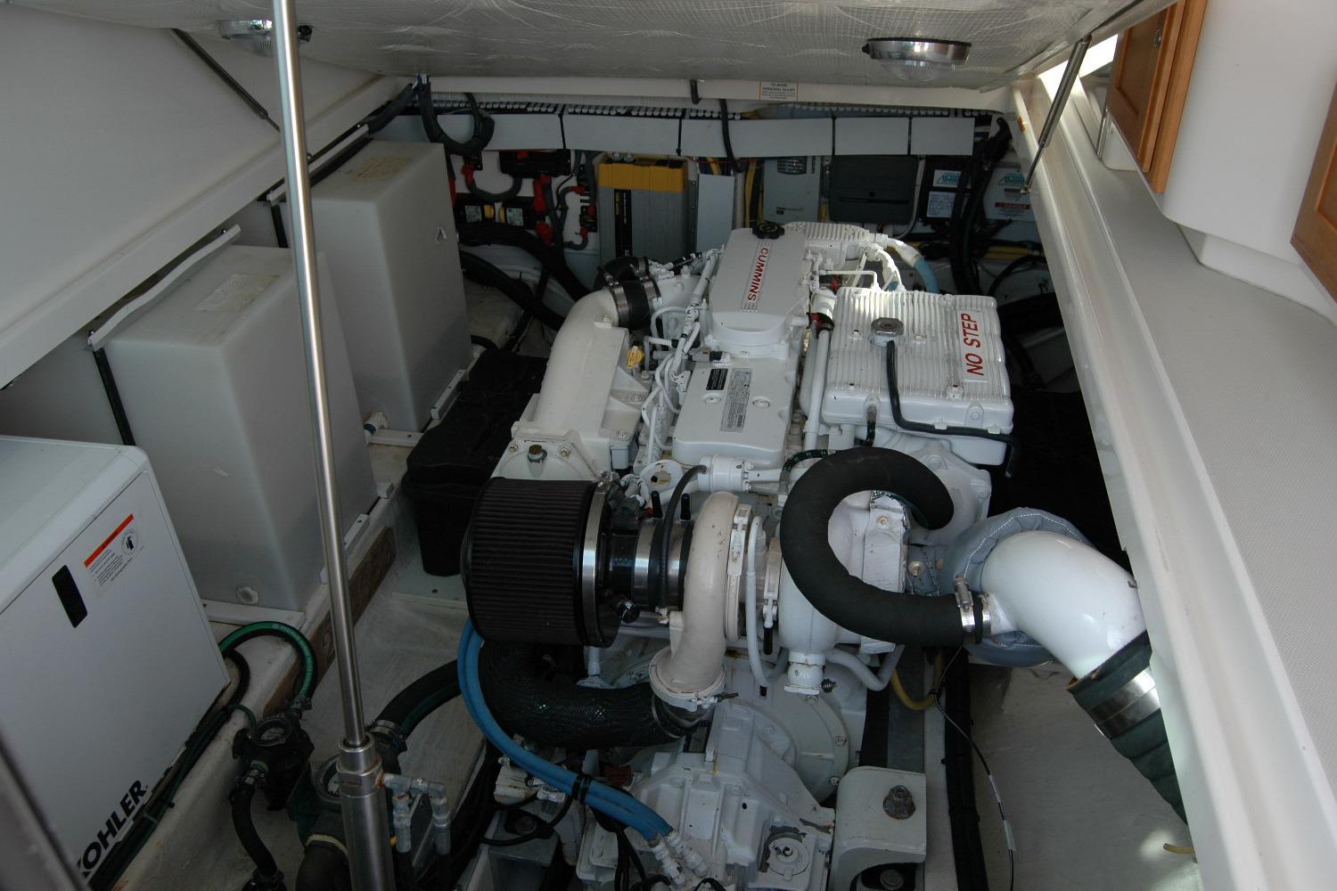 Engine room of a 2014 Back Cove 34 boat, featuring a Cummins engine.