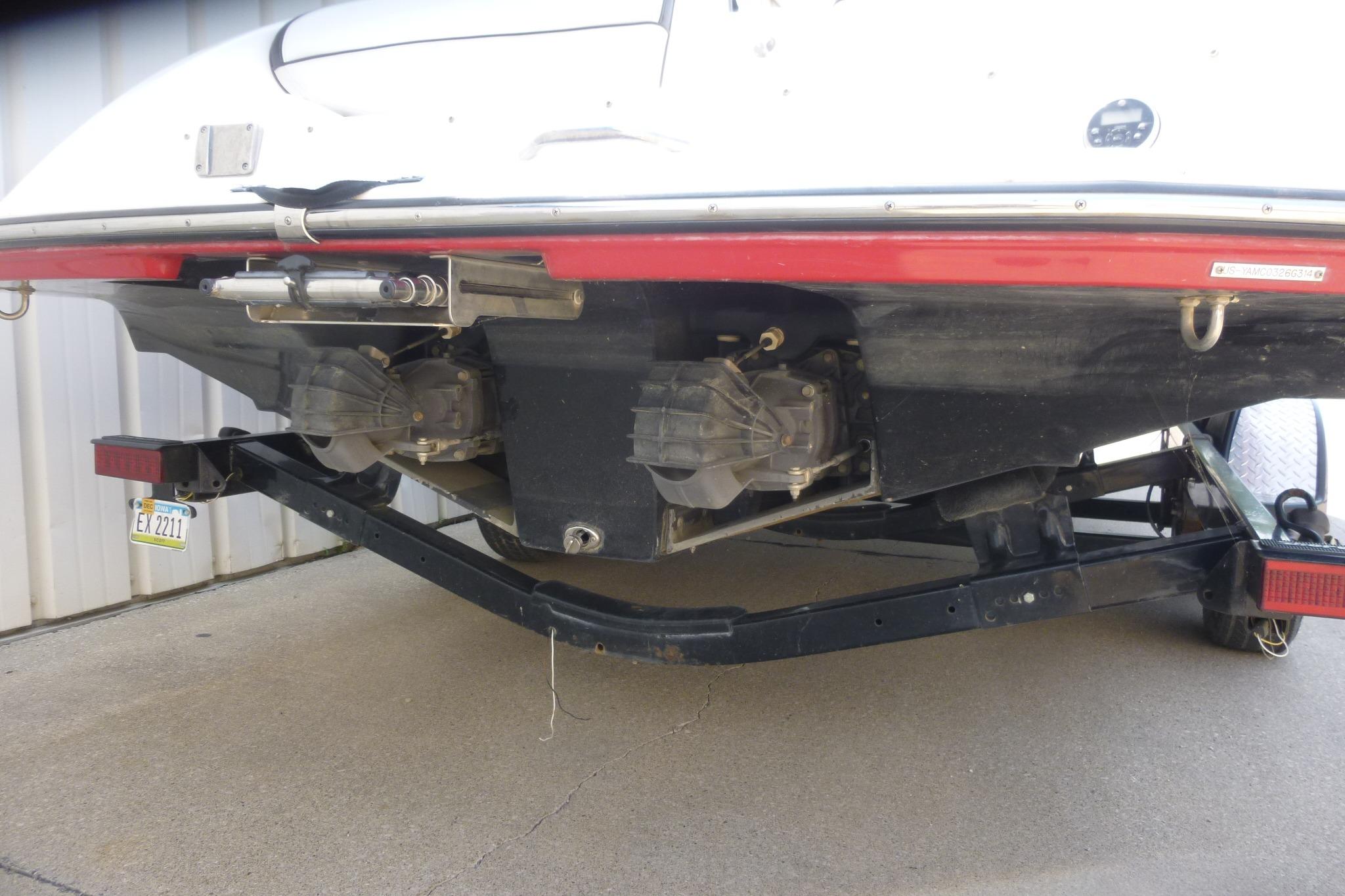 Rear view of a 2014 Yamaha Boats 240 on a trailer, showing dual jet drives.