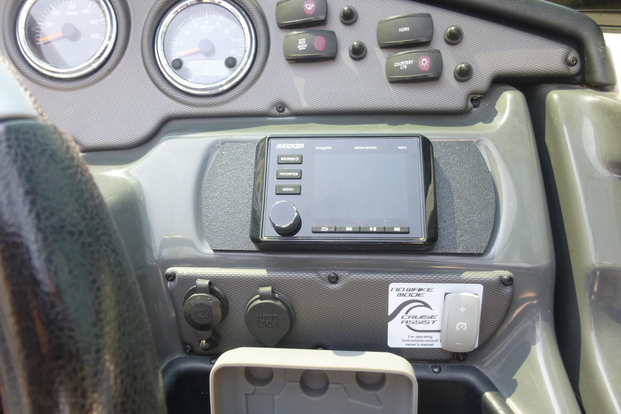 Dashboard of 2014 Yamaha Boats 240 with gauges and control panel.