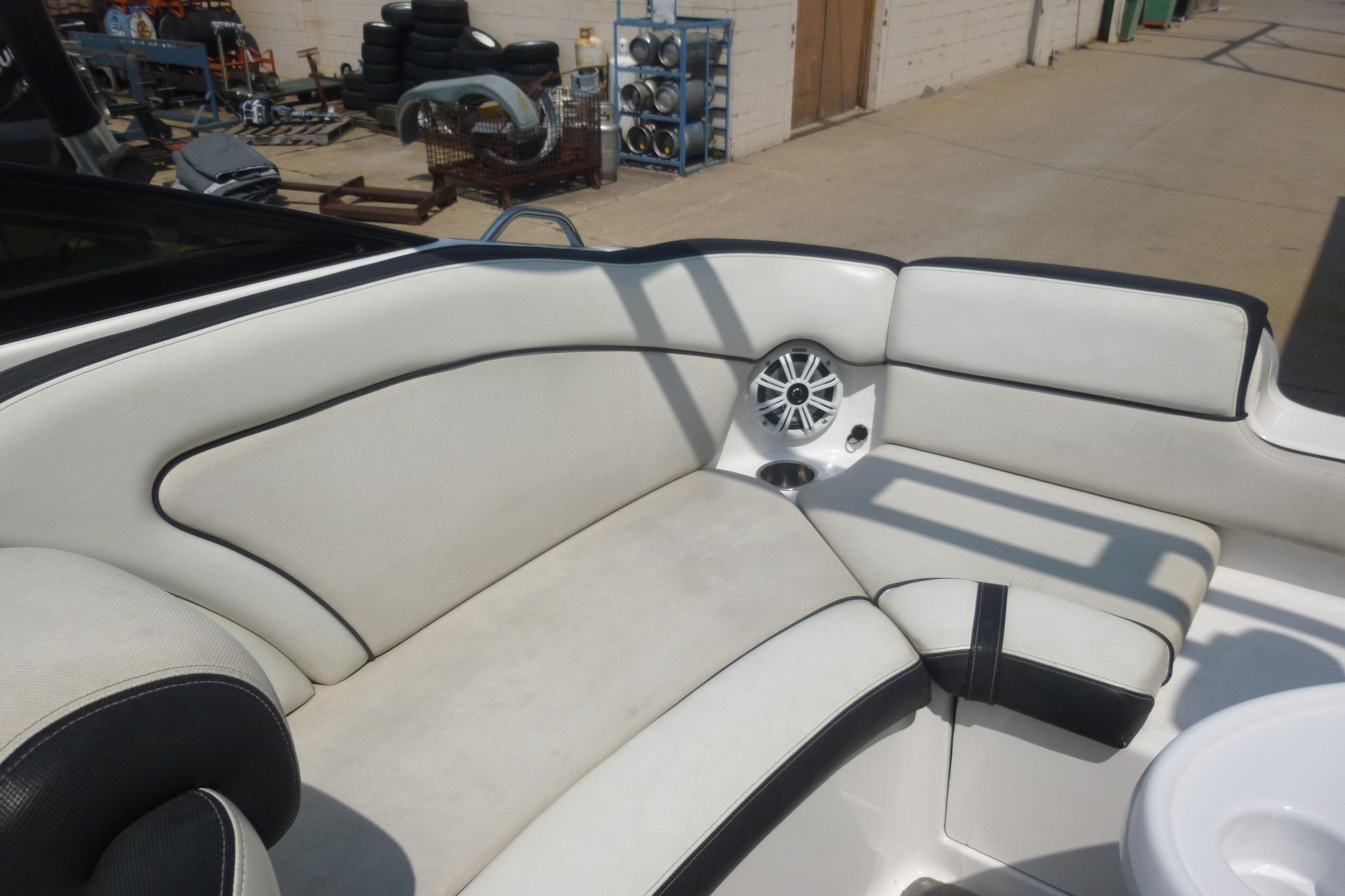 2014 Yamaha Boats 240 interior seating with speaker and cup holder.