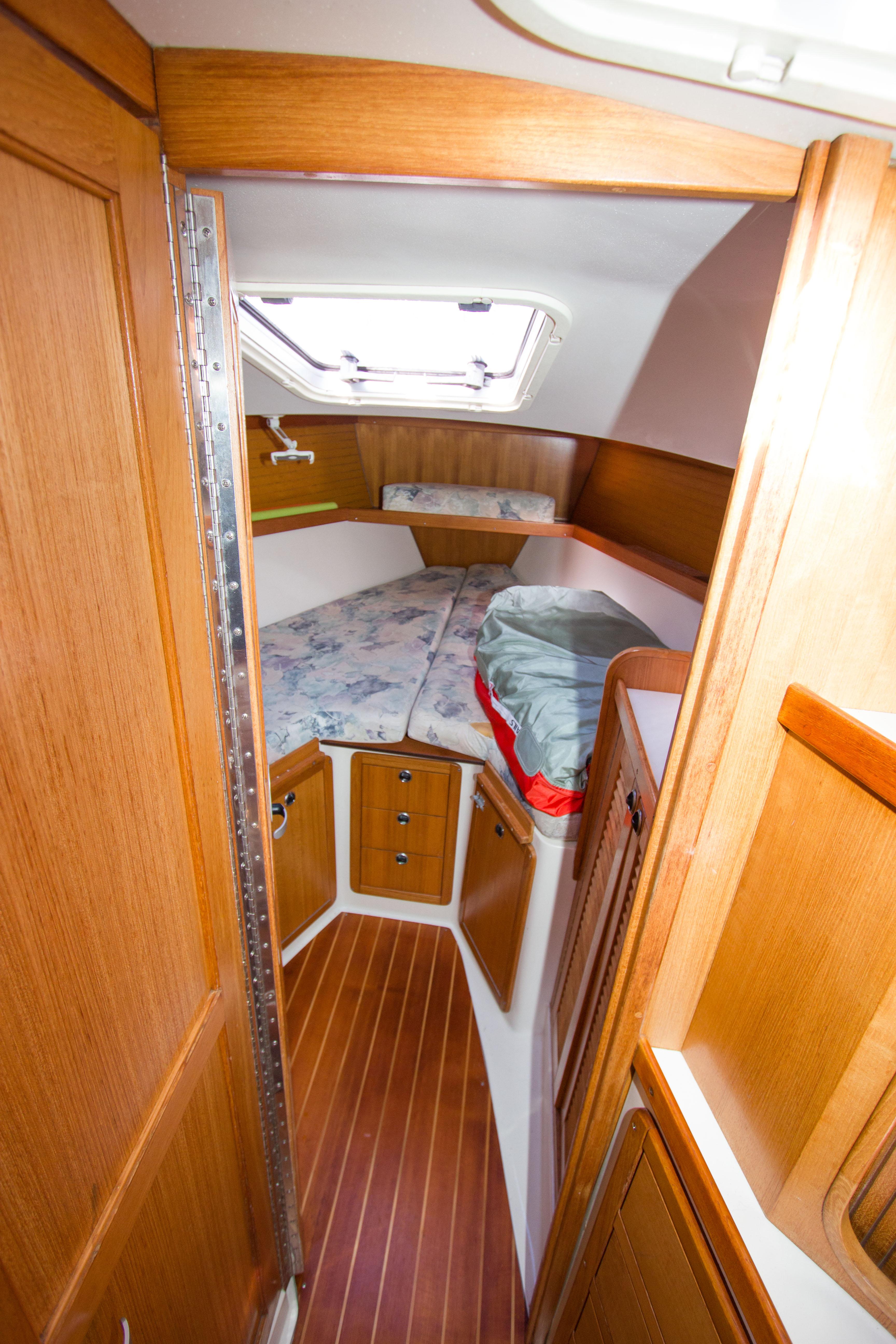 2001 Catalina MK II cabin interior with wood finish and cozy sleeping area.