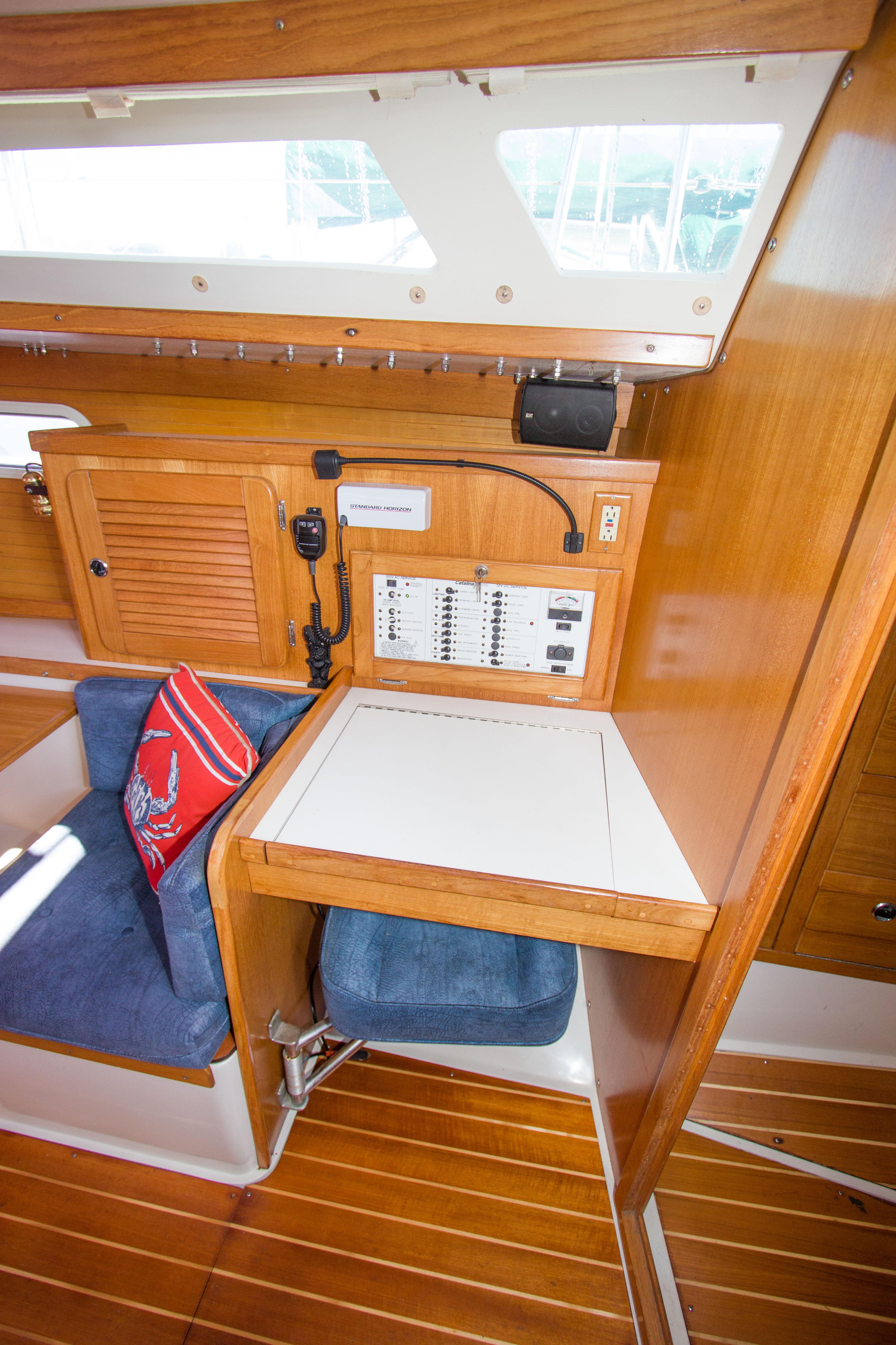 2001 Catalina MK II yacht interior with navigation station and wooden cabinetry.