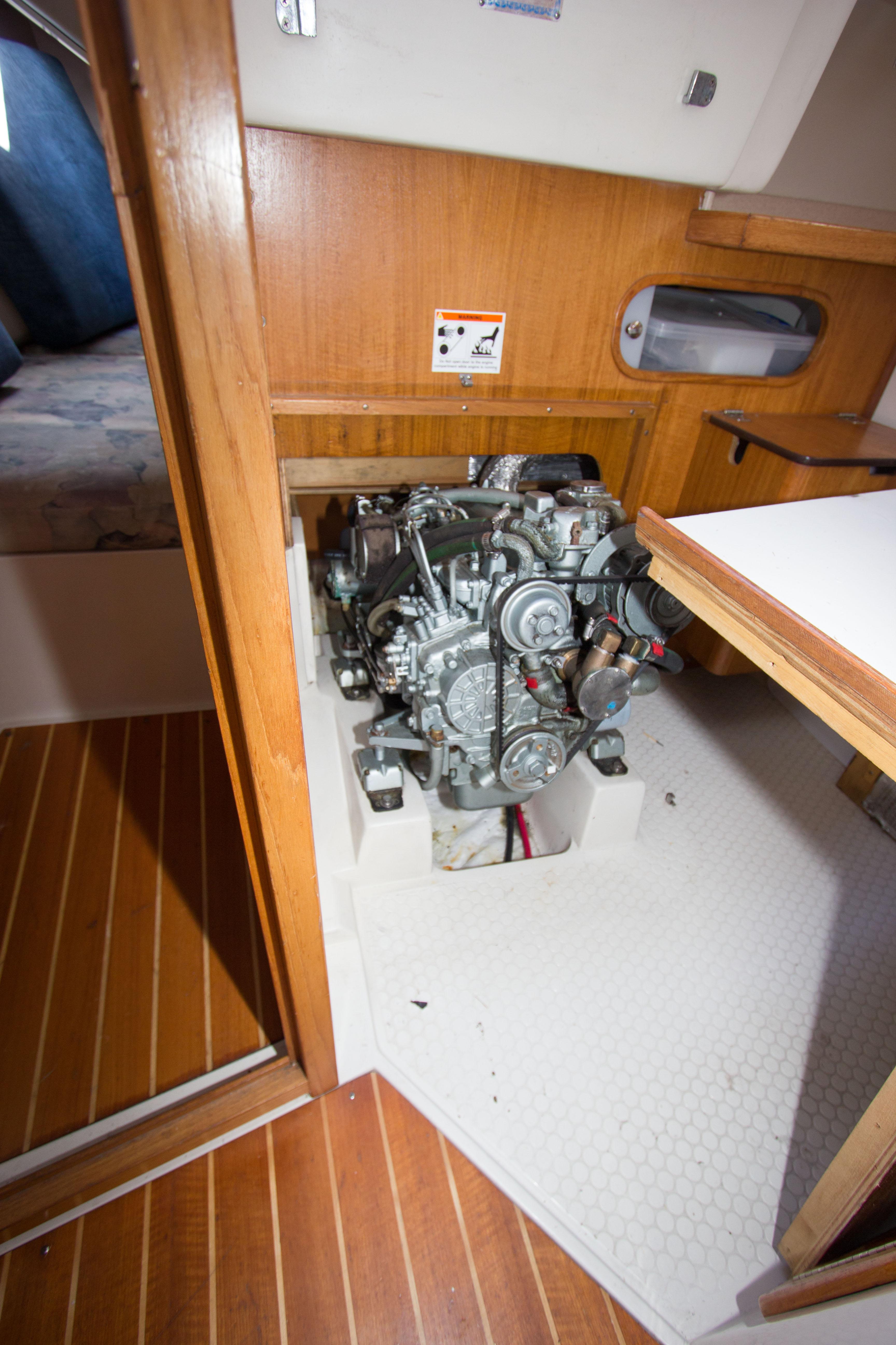 Engine compartment of a 2001 Catalina MK II sailboat, featuring a compact marine engine.