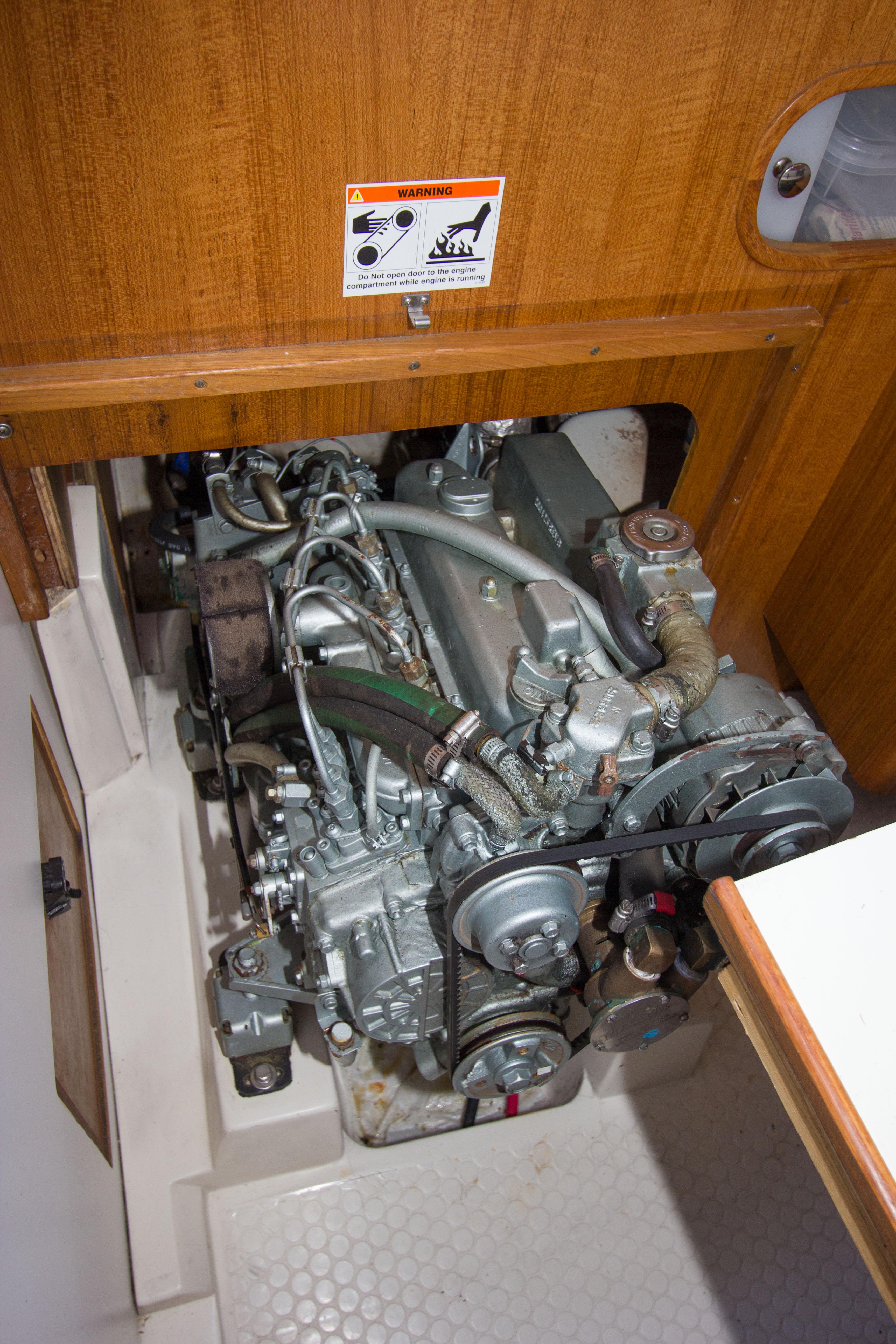 Engine compartment of a 2001 Catalina MK II sailboat, showcasing mechanical components.
