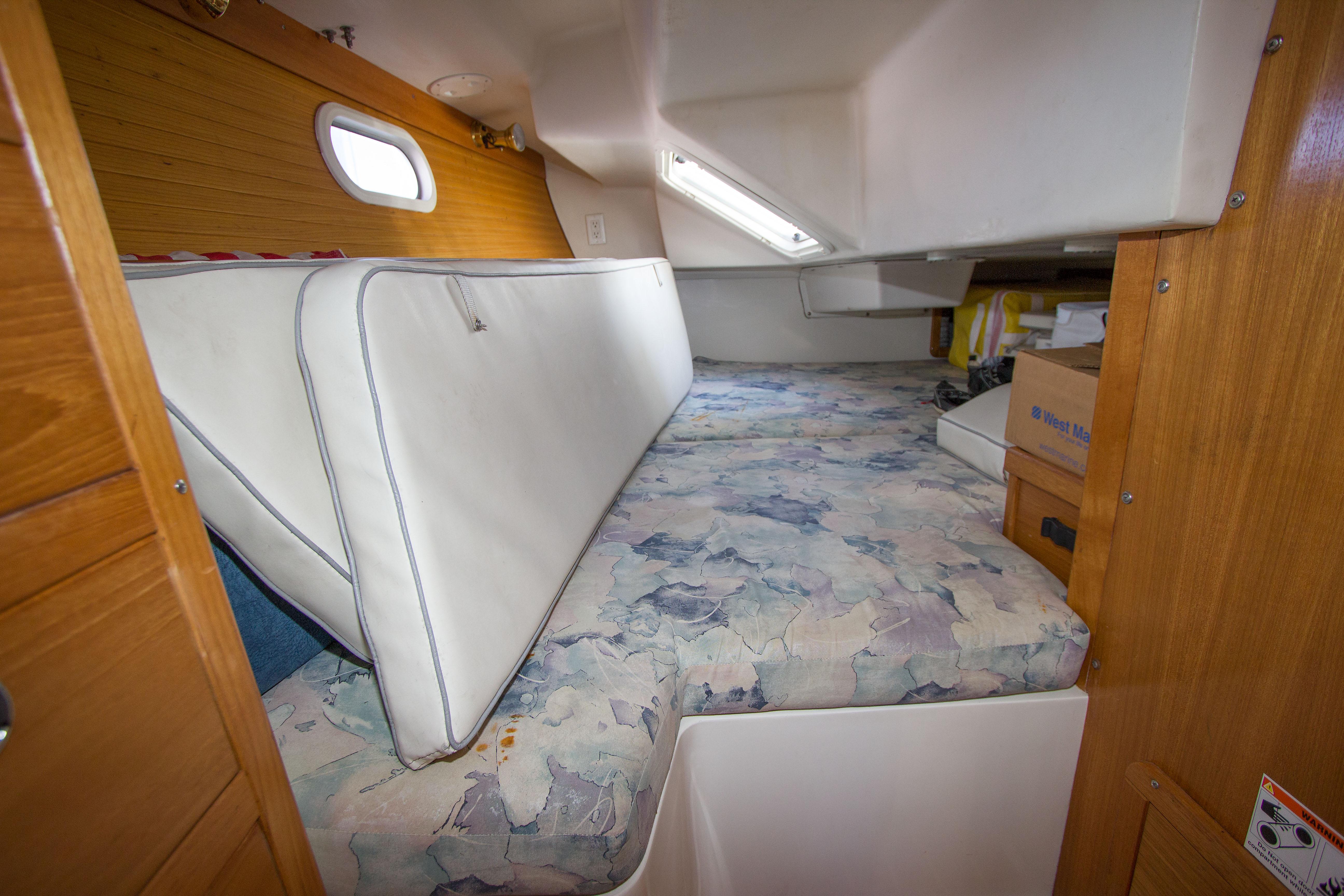 2001 Catalina MK II cabin interior with cushions and storage space.