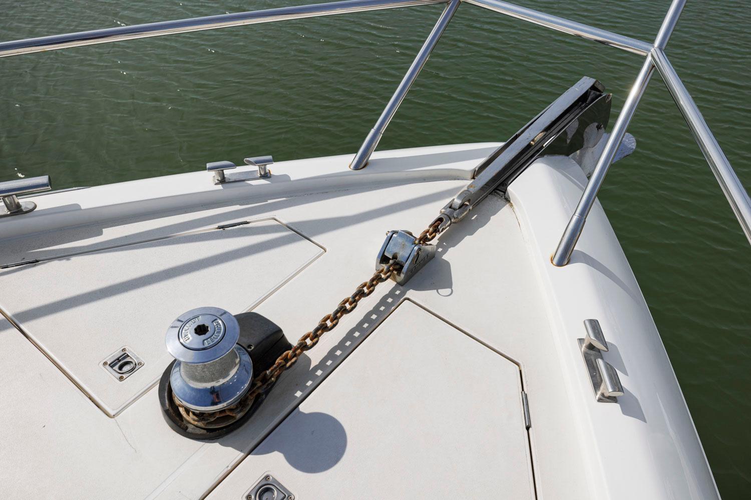 Princess-65 2003-DISMISSED CA-US-Bow of a 2003 Princess 65 yacht with anchor chain and winch.-8801006 | Thumbnail