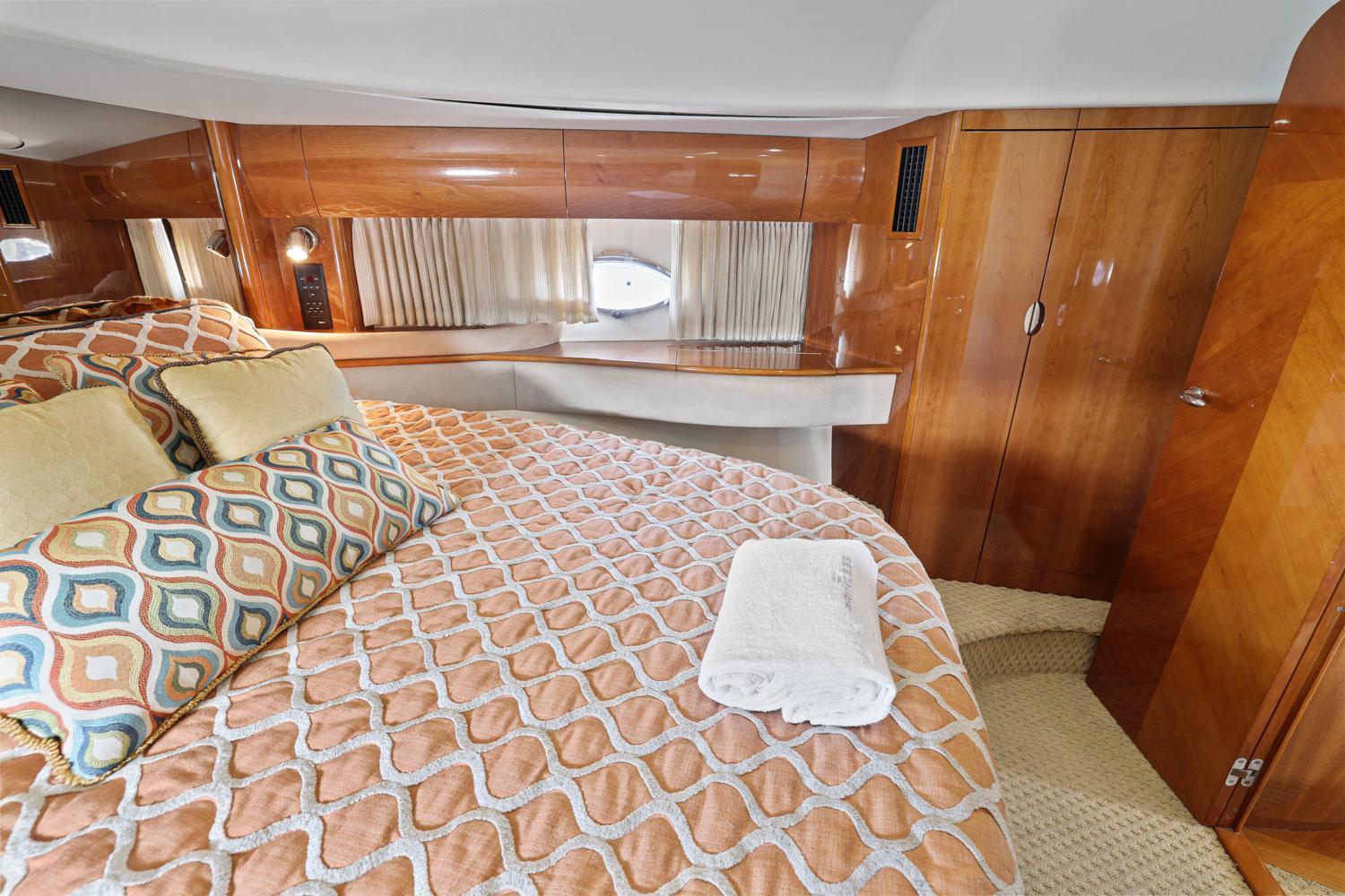 Princess-65 2003-DISMISSED CA-US-Luxurious cabin interior of 2003 Princess 65 yacht with elegant bedding and wood paneling.-8801006 | Thumbnail