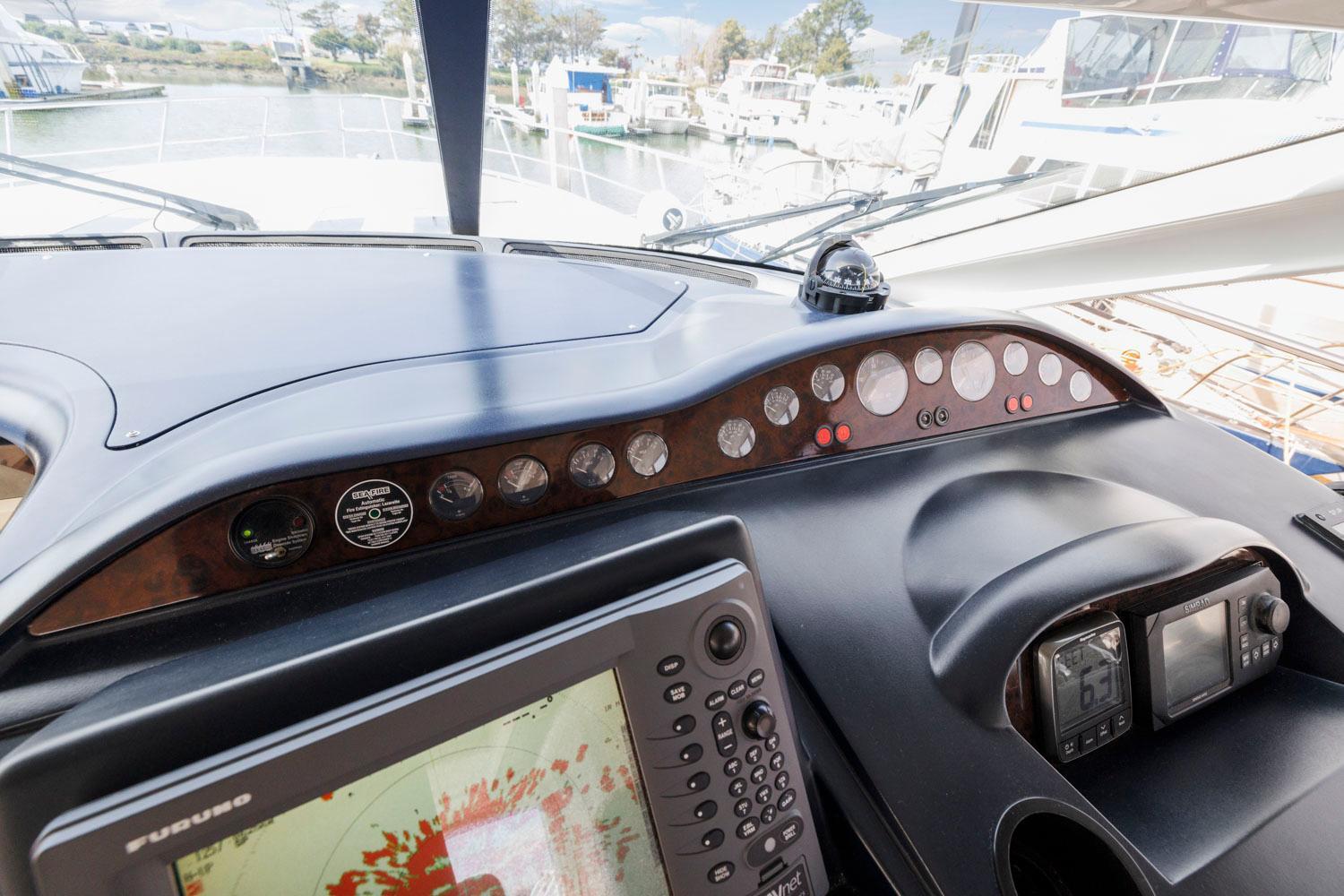 Princess-65 2003-DISMISSED CA-US-Control panel of a 2003 Princess 65 yacht with navigation instruments and gauges.-8801006 | Thumbnail