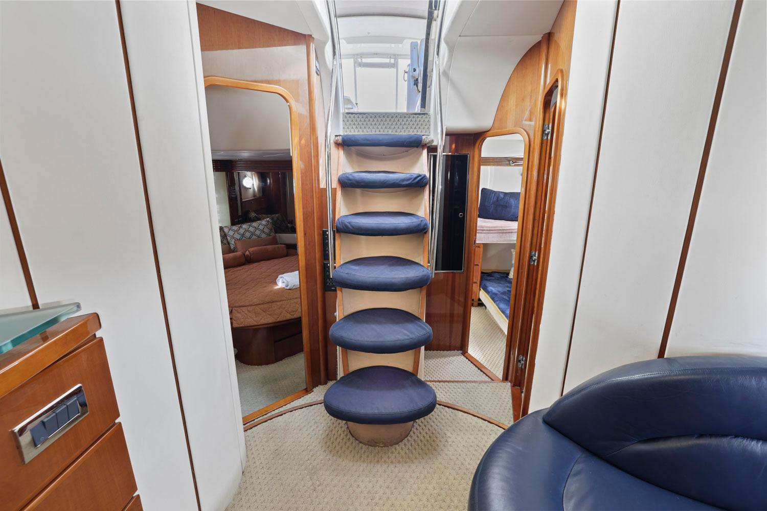 Princess-65 2003-DISMISSED CA-US-Interior of 2003 Princess 65 yacht with stairs, cabins, and luxurious seating.-8801006 | Thumbnail