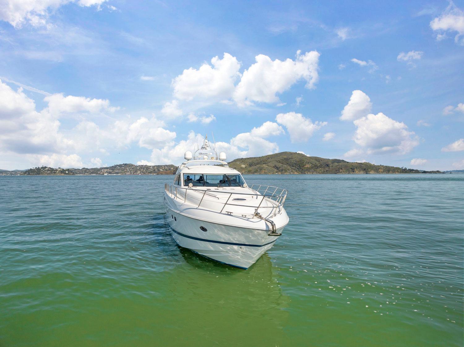 Princess-65 2003-DISMISSED CA-US-Luxury yacht Princess 65, 2003 model, cruising on serene waters under a clear blue sky.-8801006 | Thumbnail