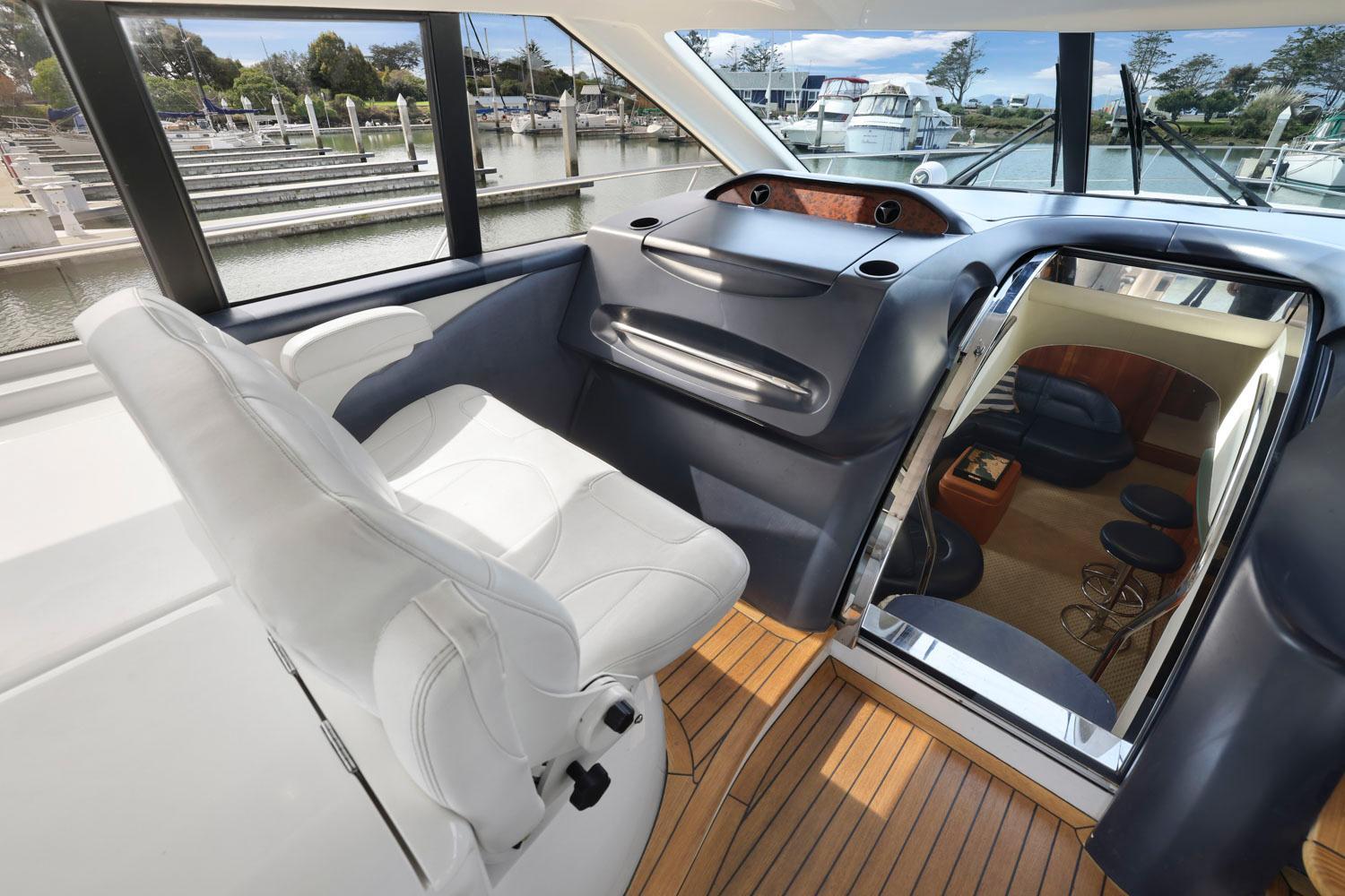 Princess-65 2003-DISMISSED CA-US-Interior of 2003 Princess 65 yacht with helm seat and cabin view.-8801006 | Thumbnail