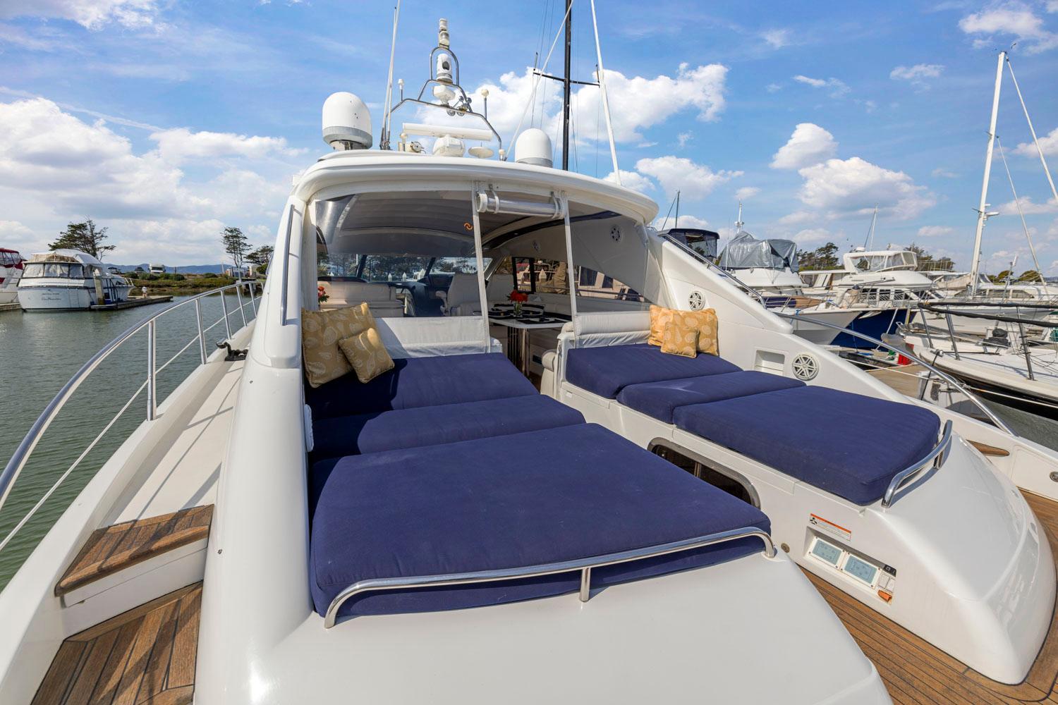 Princess-65 2003-DISMISSED CA-US-Luxury 2003 Princess 65 yacht with blue sunbeds docked at marina.-8801006 | Thumbnail