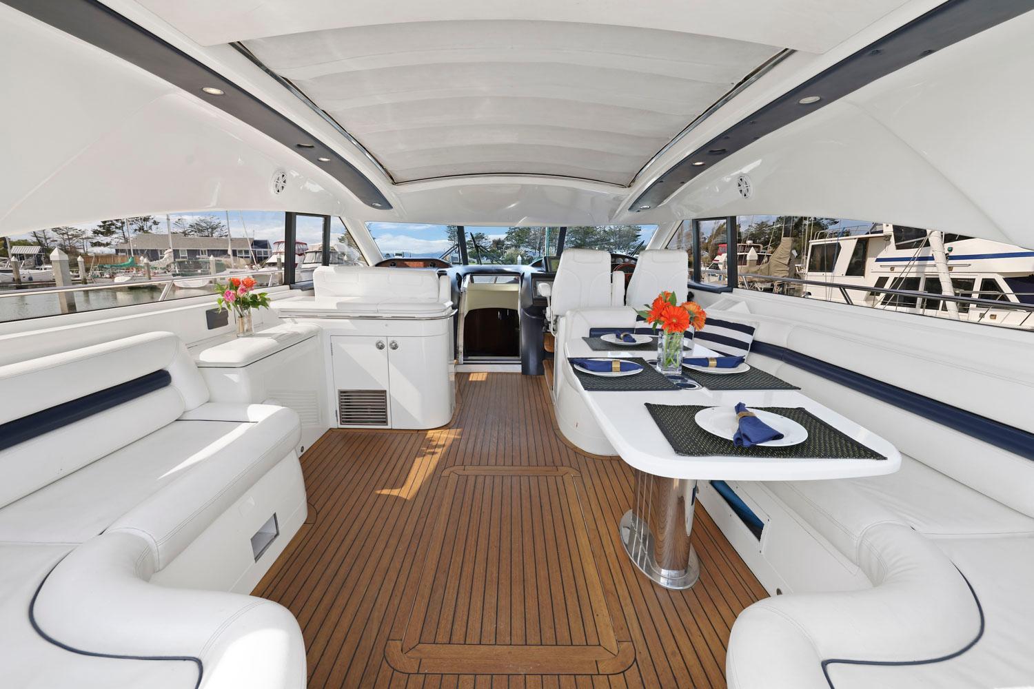 Princess-65 2003-DISMISSED CA-US-Luxurious 2003 Princess 65 yacht interior with elegant dining setup and white seating.-8801006 | Thumbnail