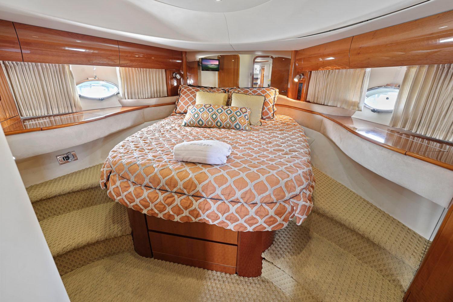 Princess-65 2003-DISMISSED CA-US-Luxurious cabin interior of 2003 Princess 65 yacht with cozy bed and elegant wood finish.-8801006 | Thumbnail