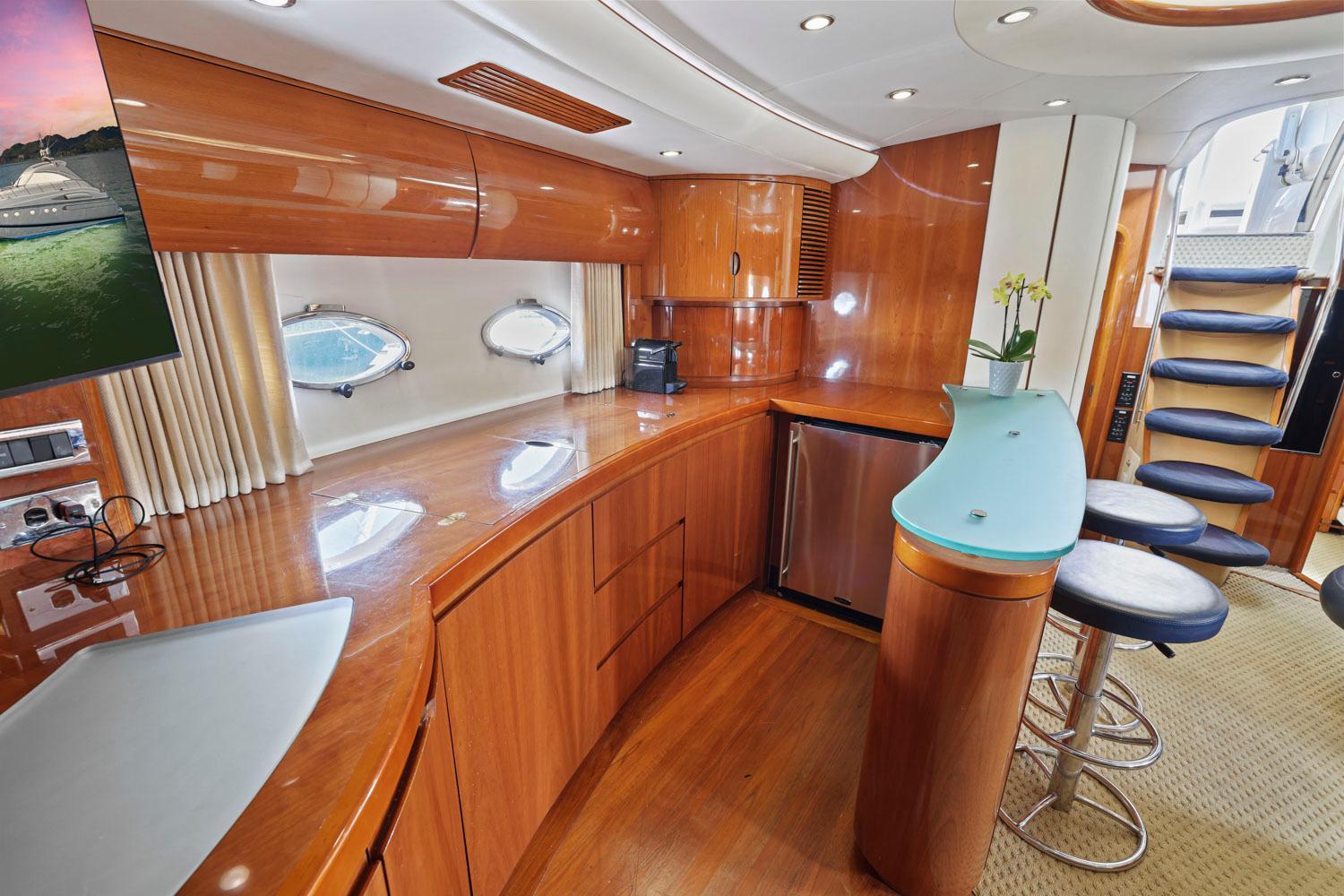 Princess-65 2003-DISMISSED CA-US-Luxurious interior of 2003 Princess 65 yacht with modern kitchen and seating area.-8801006 | Thumbnail