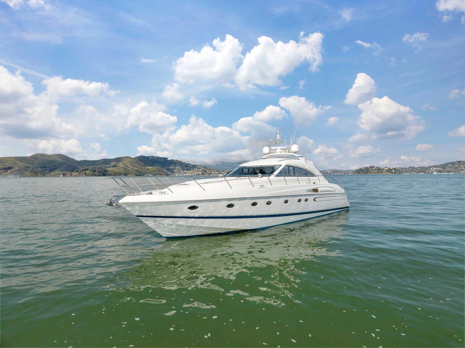 Princess-65 2003-DISMISSED CA-US-Luxury 2003 Princess 65 yacht cruising on serene waters under a blue sky.-8801006 | Thumbnail