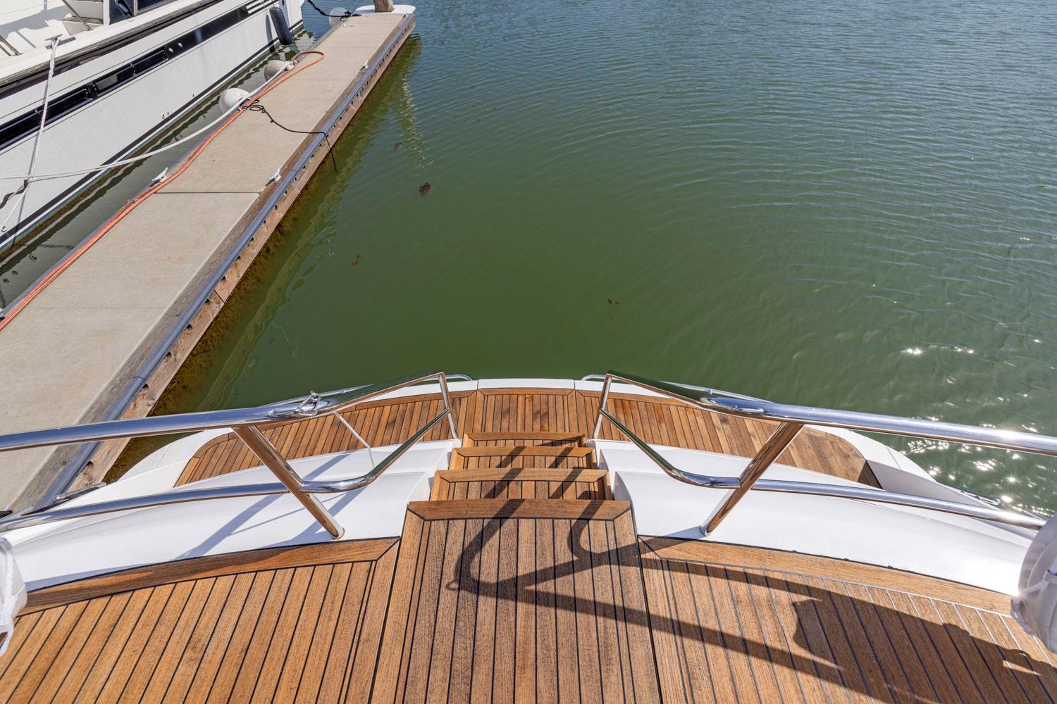 Princess-65 2003-DISMISSED CA-US-Wooden deck of a 2003 Princess 65 yacht docked at a marina.-8801006 | Thumbnail