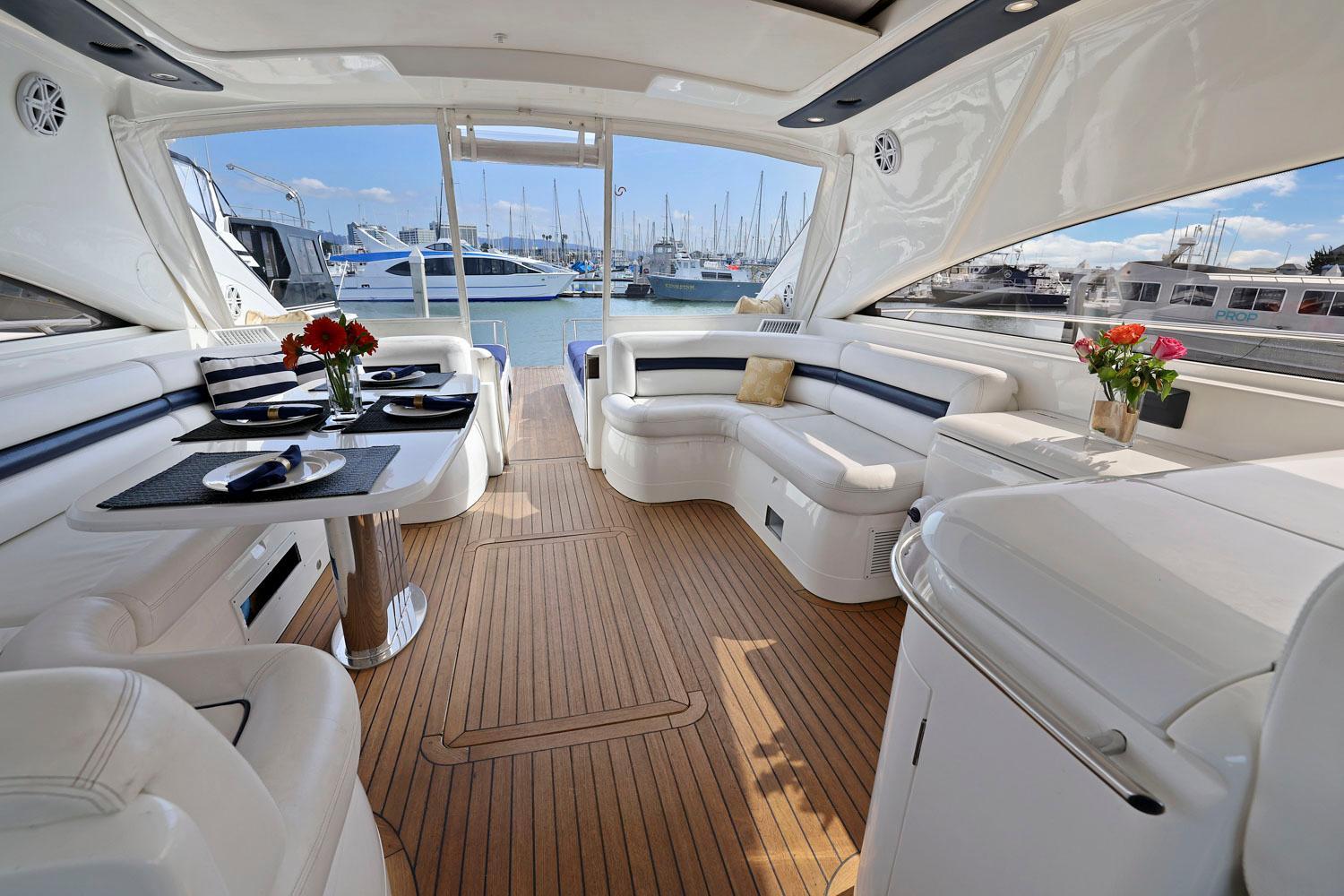 Princess-65 2003-DISMISSED CA-US-Luxurious interior of a 2003 Princess 65 yacht with elegant seating and dining area.-8801006 | Thumbnail