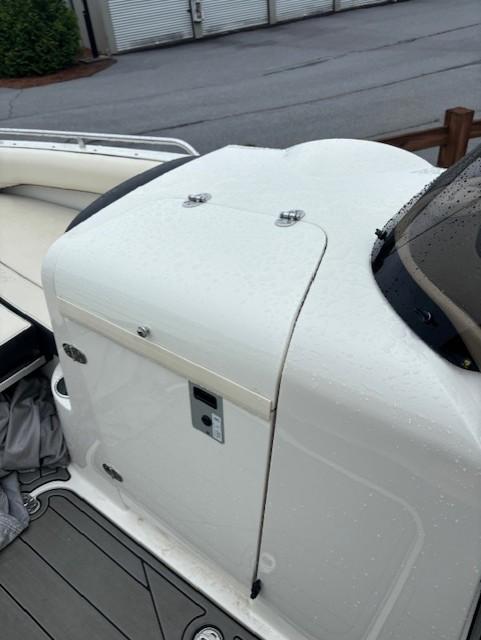2021 Stingray 212 SC boat with sleek white design and modern features.