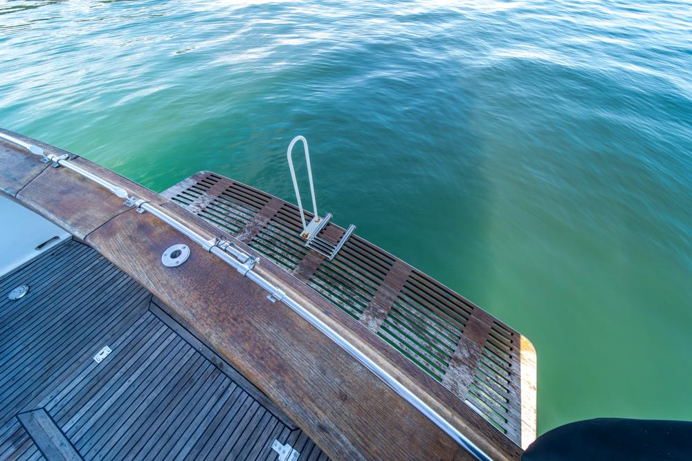 Ocean Alexander-Cockpit M/Y 1986-Take Chances WA-US-Ocean Alexander 1986 Cockpit M/Y swim platform with ladder, overlooking calm water.-9621089 | Thumbnail