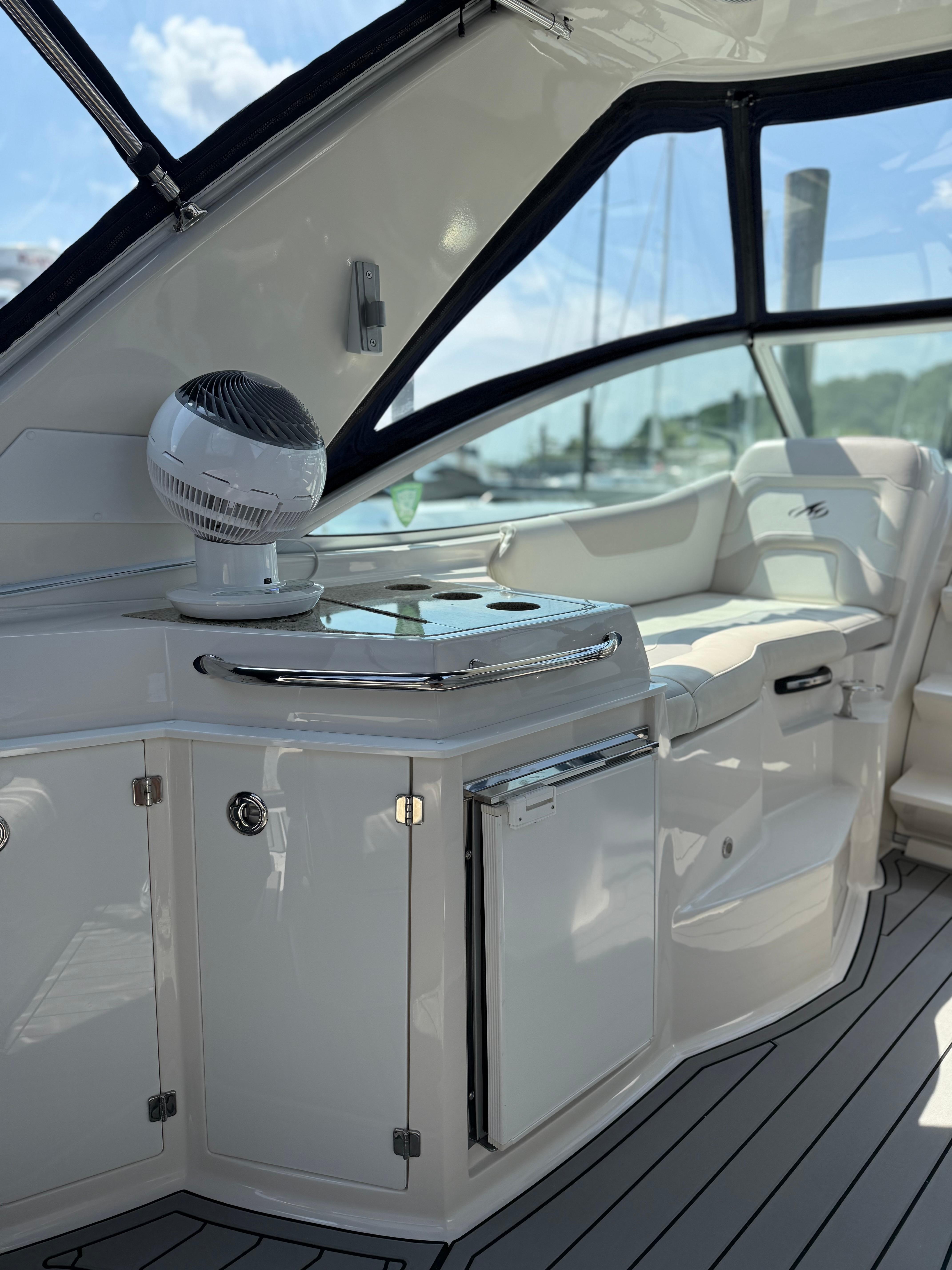 2009 Monterey 280 SCR yacht interior with sleek white cabinetry and seating.