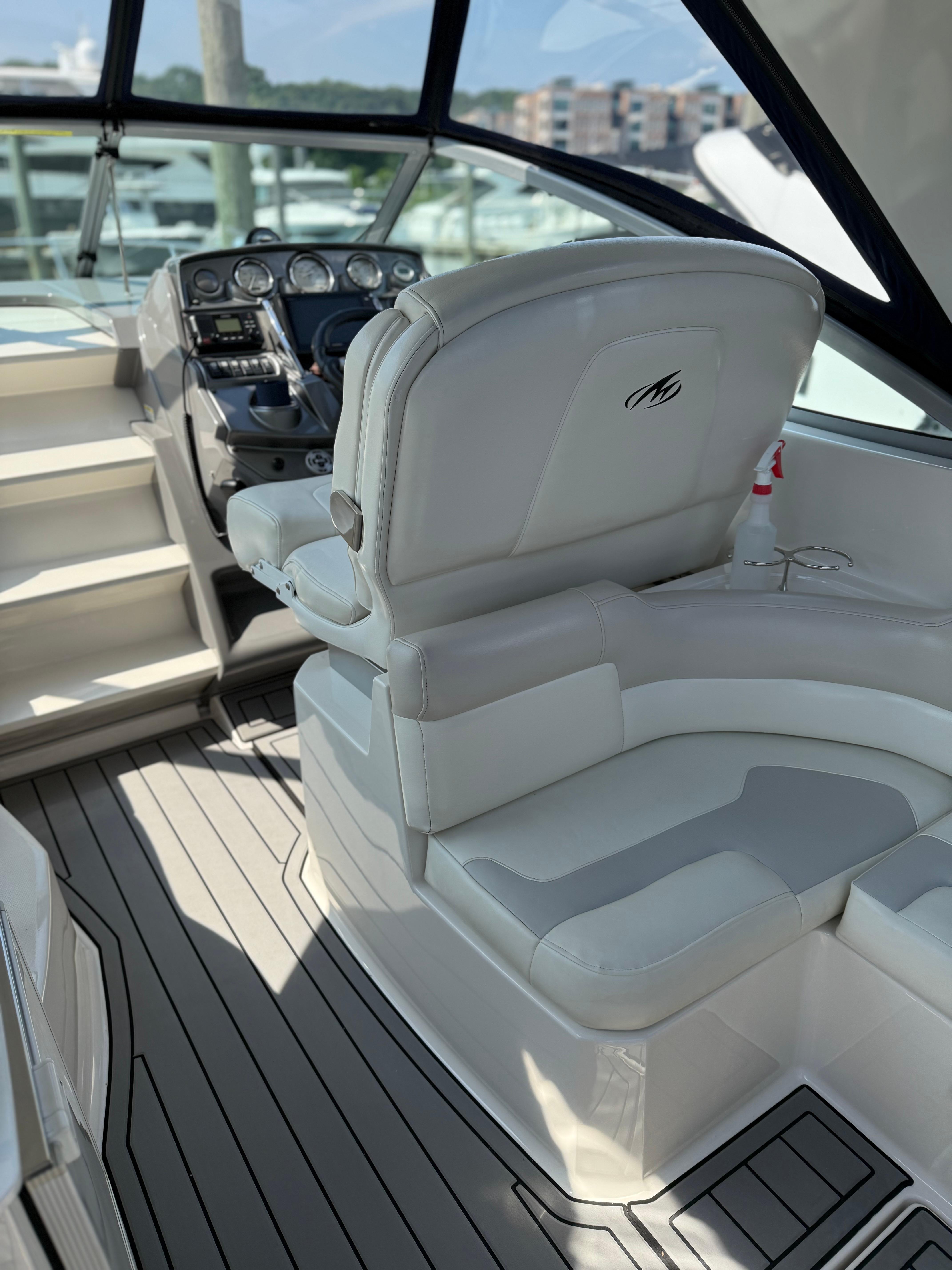 2009 Monterey 280 SCR boat interior with helm and seating area.