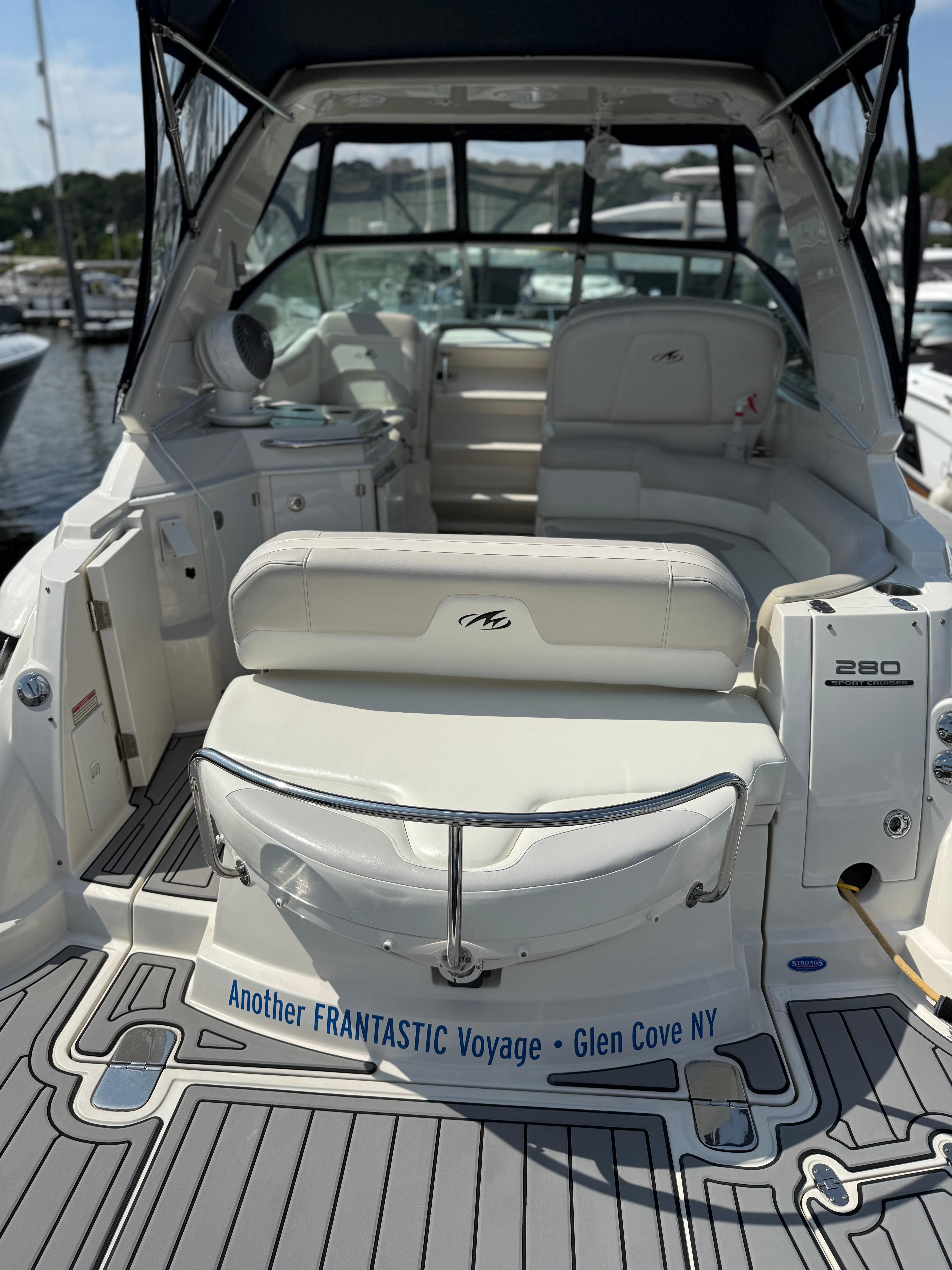 2009 Monterey 280 SCR boat interior with seating, docked at Glen Cove, NY.