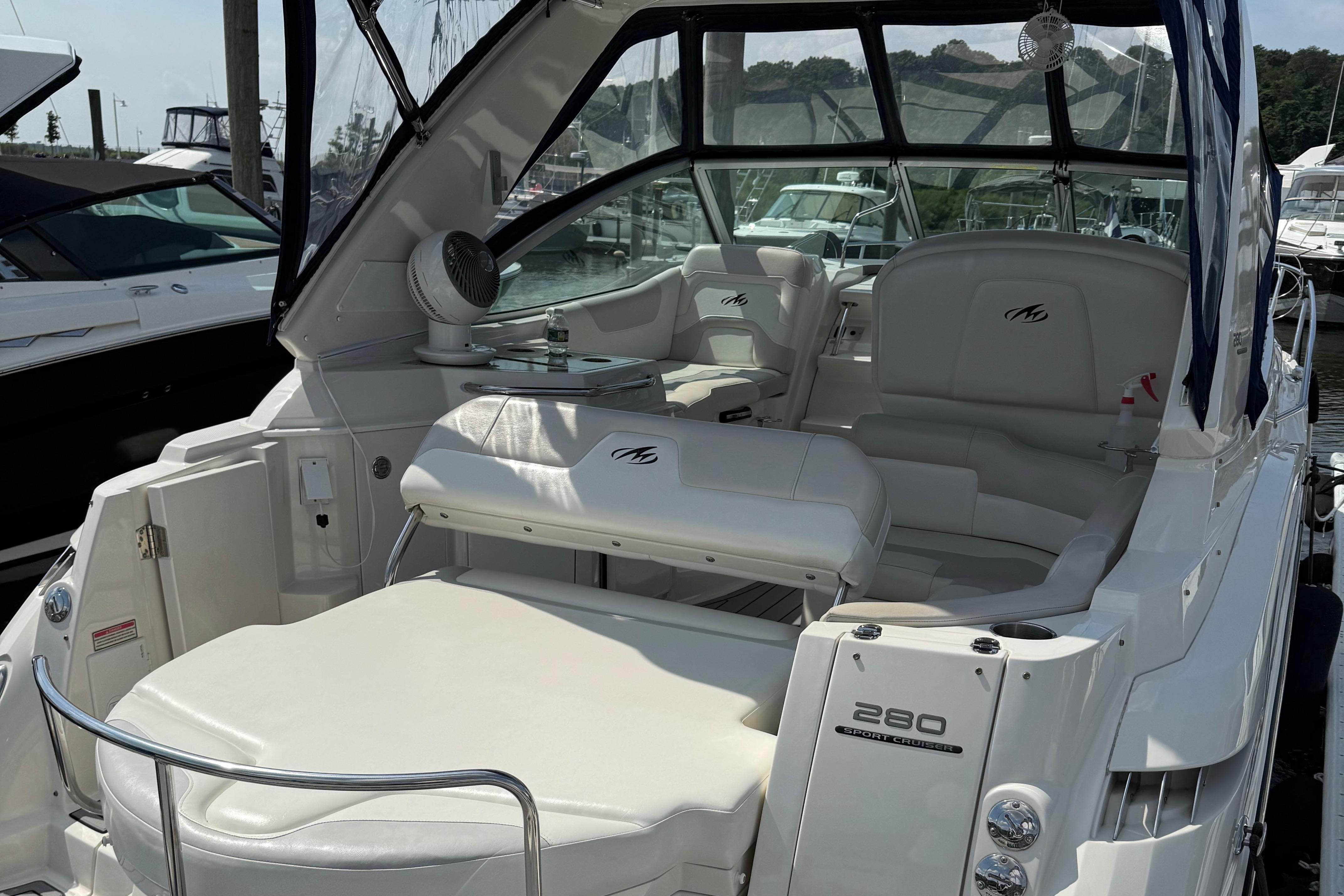2009 Monterey 280 SCR boat interior with white seating and sleek design.