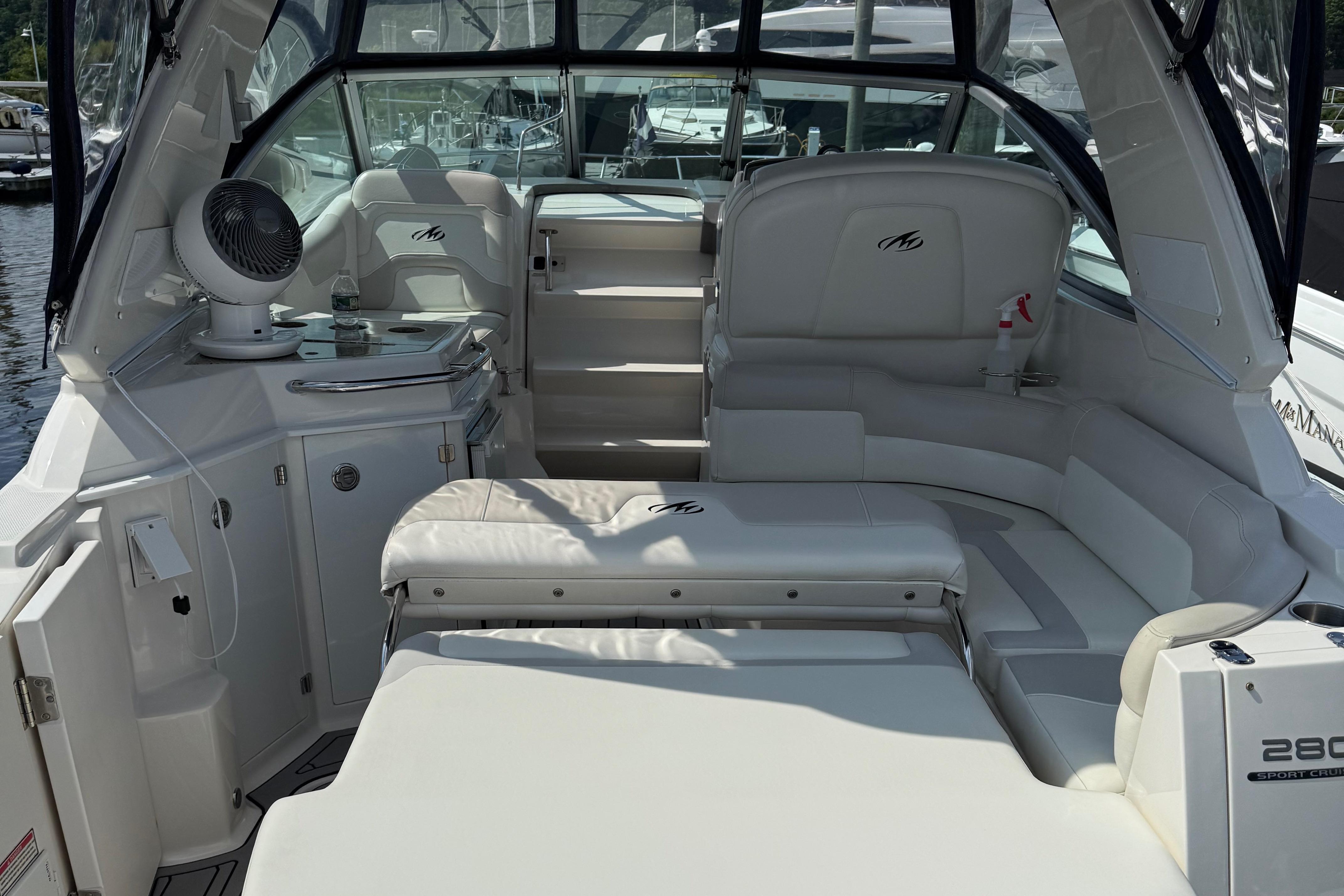 2009 Monterey 280 SCR boat interior with white seating and modern amenities.