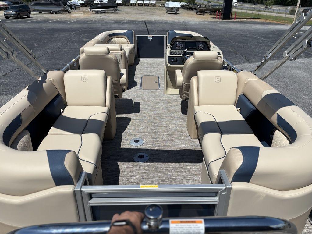 2025 Godfrey SWEETWATER 2286 SB pontoon boat interior with beige seating and steering console.