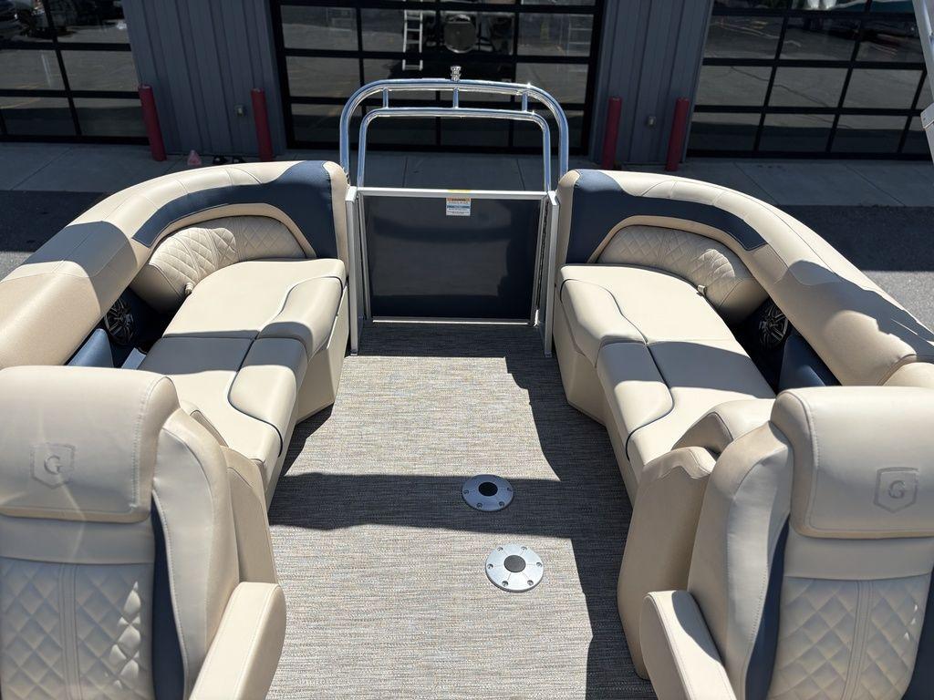 2025 Godfrey SWEETWATER 2286 SB pontoon boat interior with beige seating and carpeted floor.