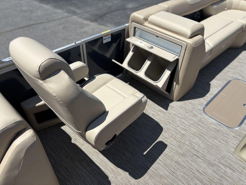 2025 Godfrey SWEETWATER 2286 SB boat interior with beige seating and storage compartments.