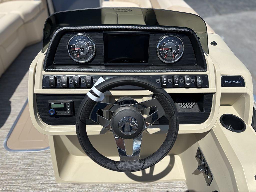 2025 Godfrey SWEETWATER 2286 SB boat dashboard with steering wheel and control panel.