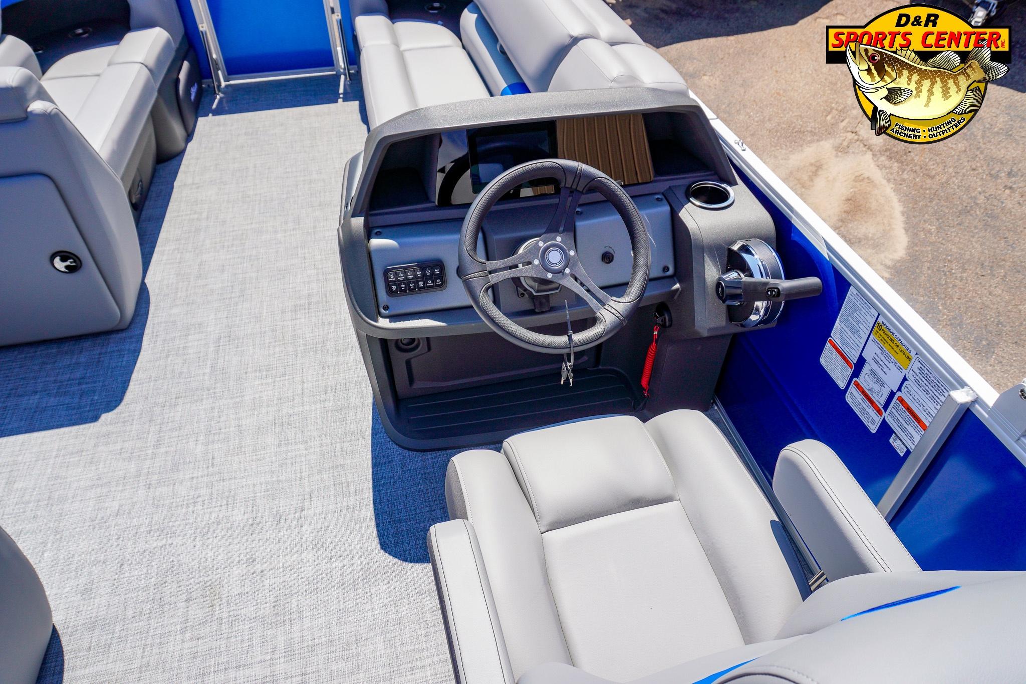 2026 Sun Tracker Party Barge 20 DLX interior with steering wheel and seating.