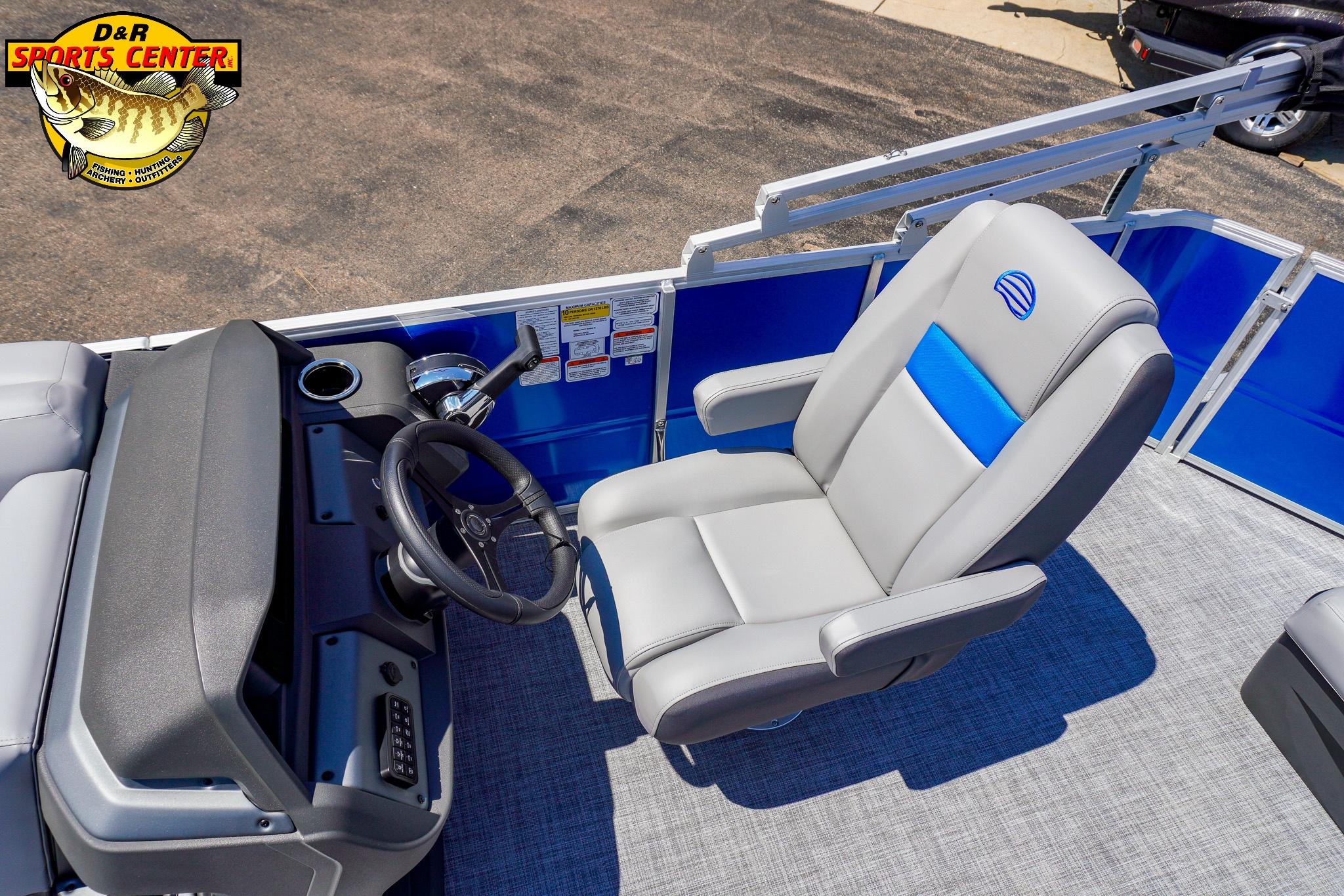 2026 Sun Tracker Party Barge 20 DLX interior with steering wheel and captain's chair.