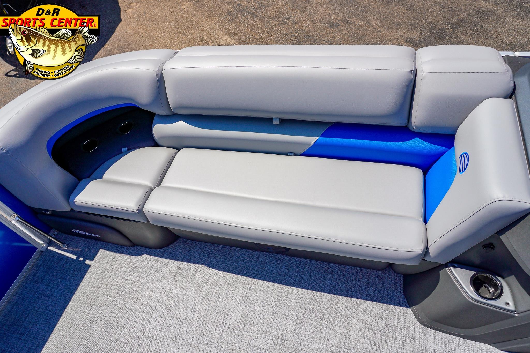2026 Sun Tracker Party Barge 20 DLX interior seating with gray and blue upholstery.