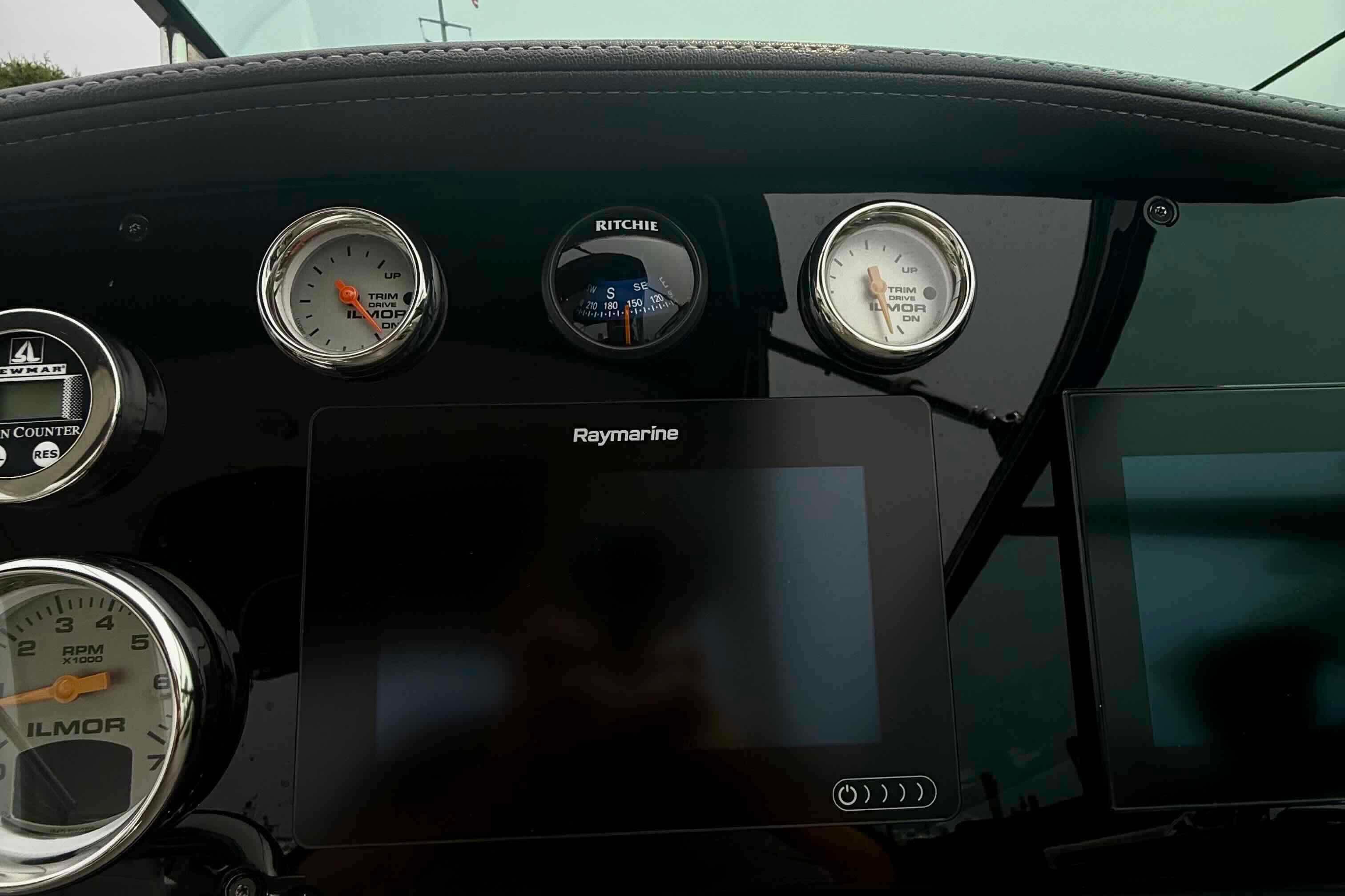 Dashboard of 2020 Formula 290 Bowrider with gauges and Raymarine display.