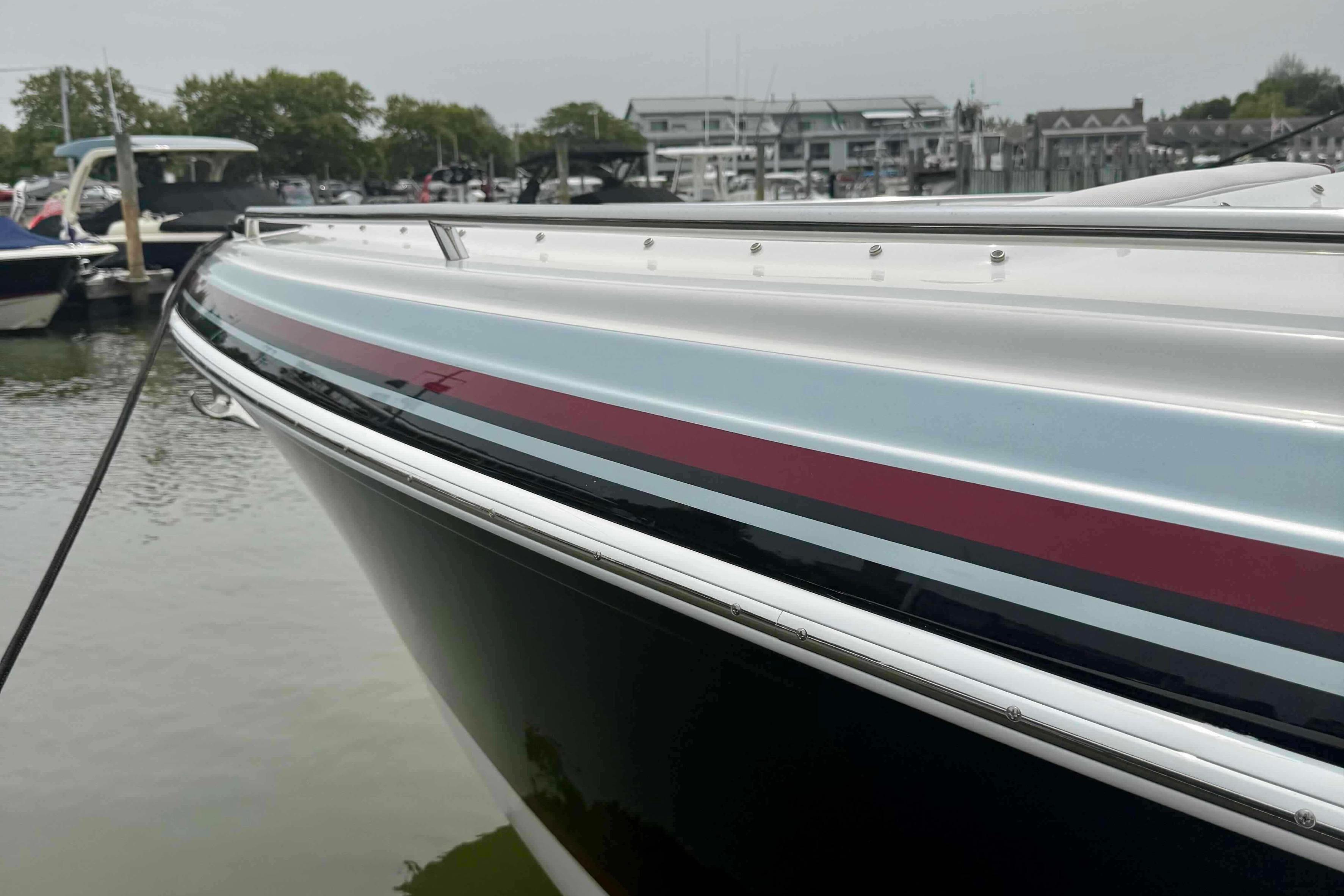 2020 Formula 290 Bowrider boat docked at a marina, showcasing sleek design and vibrant colors.