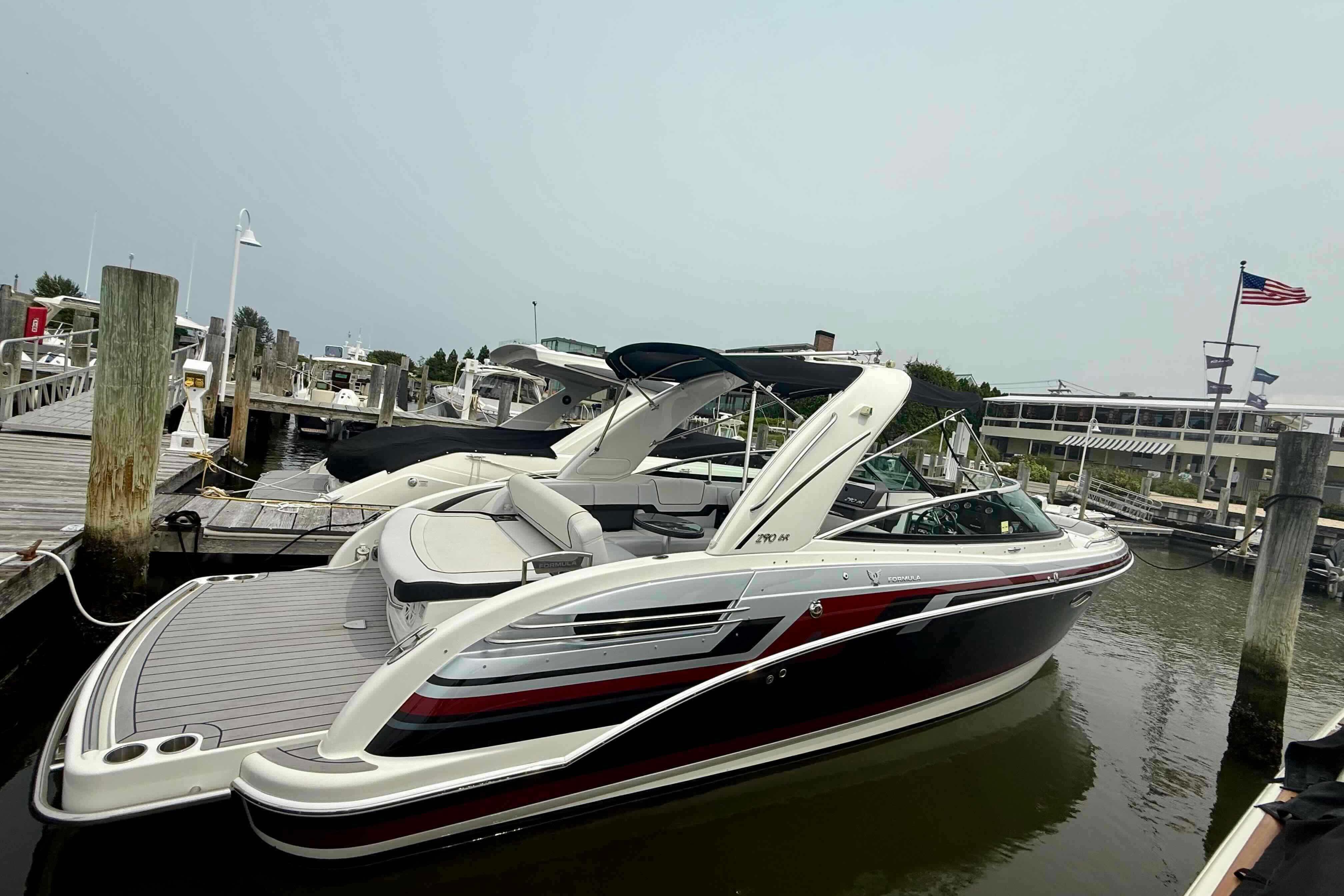2020 Formula 290 Bowrider docked at marina, sleek design, luxury boat.