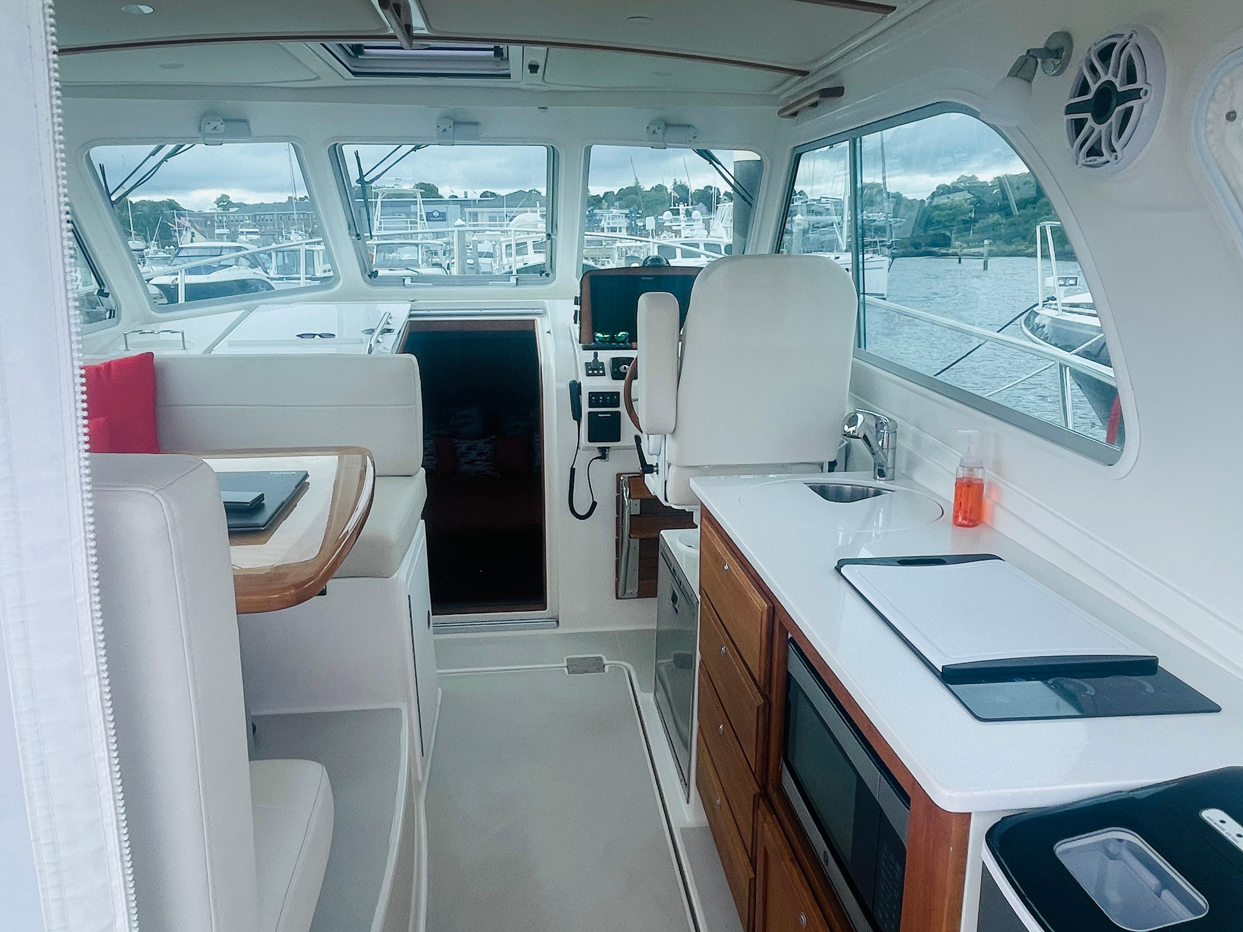 Sea Kat Yacht Photos Pics Spotless salon and Galley with stainless sink and microwave